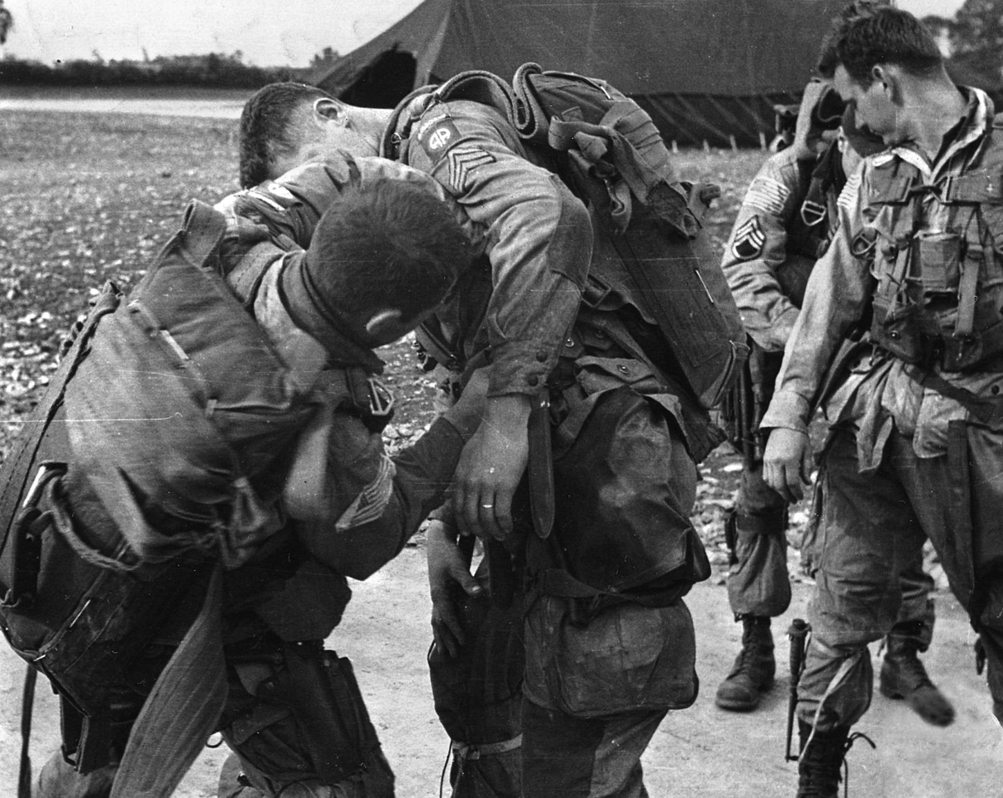 Men of the 82nd adjust gear before boarding their transports on June 5, 1944.