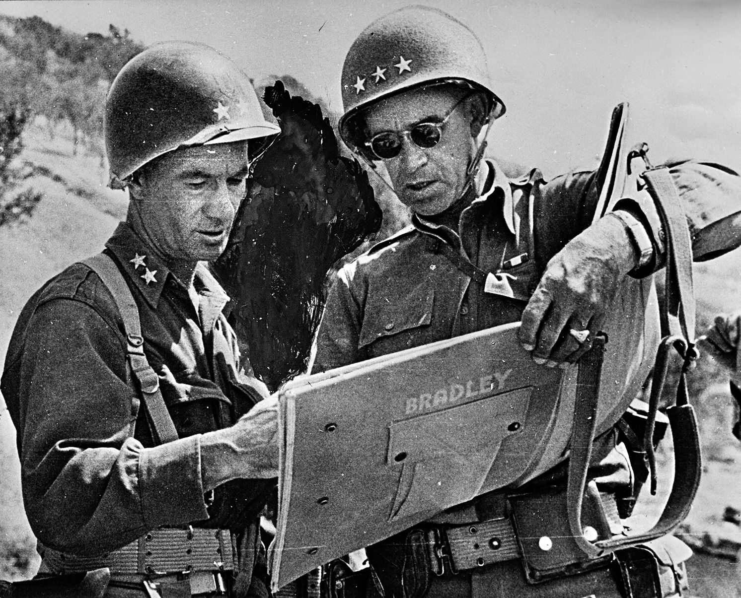 Lieutenant General Omar Bradley, II Corps commander (right), and 1st Infantry Division commander Maj. Gen. Terry Allen discuss plans to advance across Sicily. Bradley was not an Allen fan and did much to remove him from command of the Big Red One after the battle of Troina. 