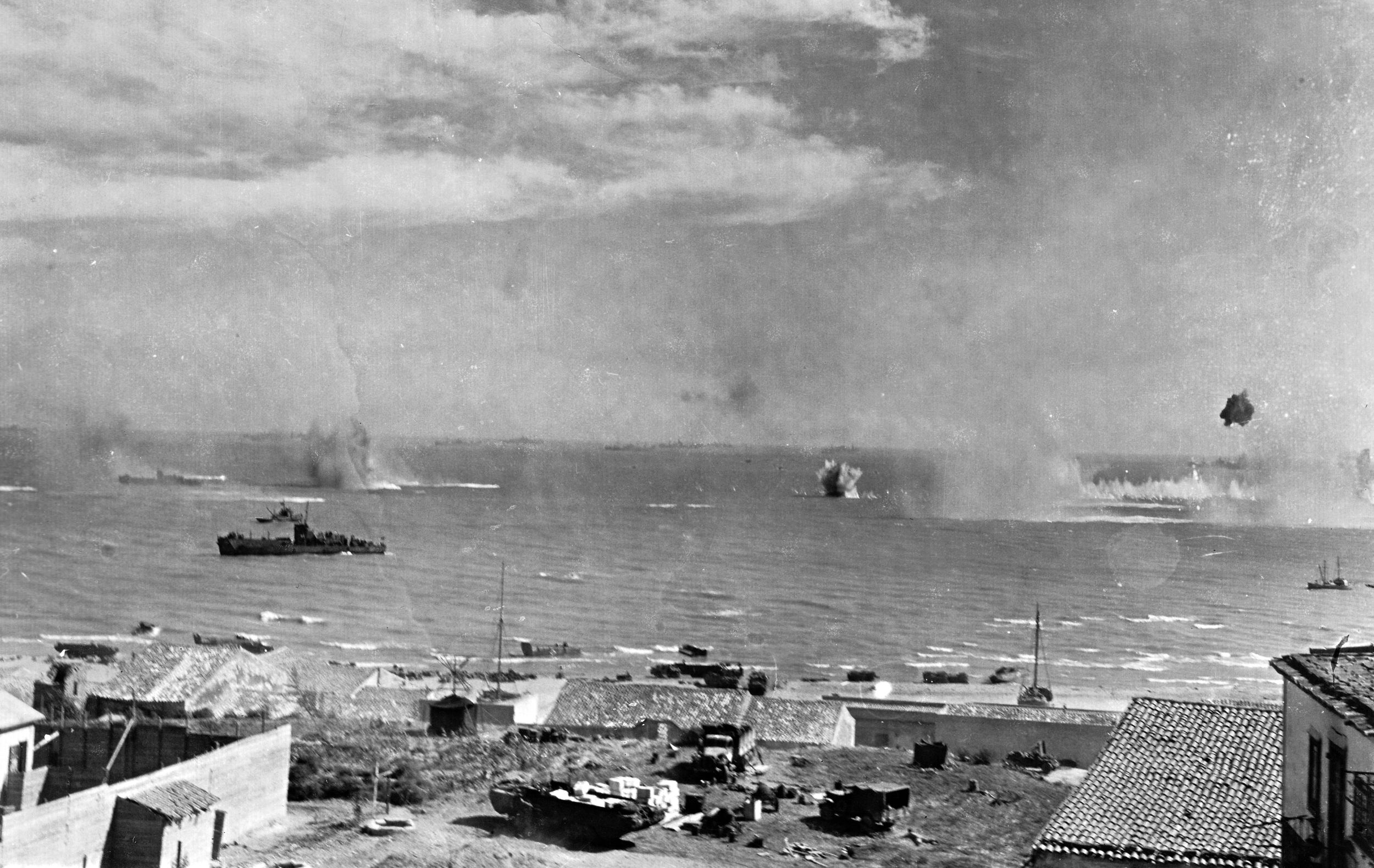 American ships come under aerial attack from German bombers off the coast of the southeastern city of Gela, where the U.S. 1st Infantry Division came ashore on July 10, 1943.
