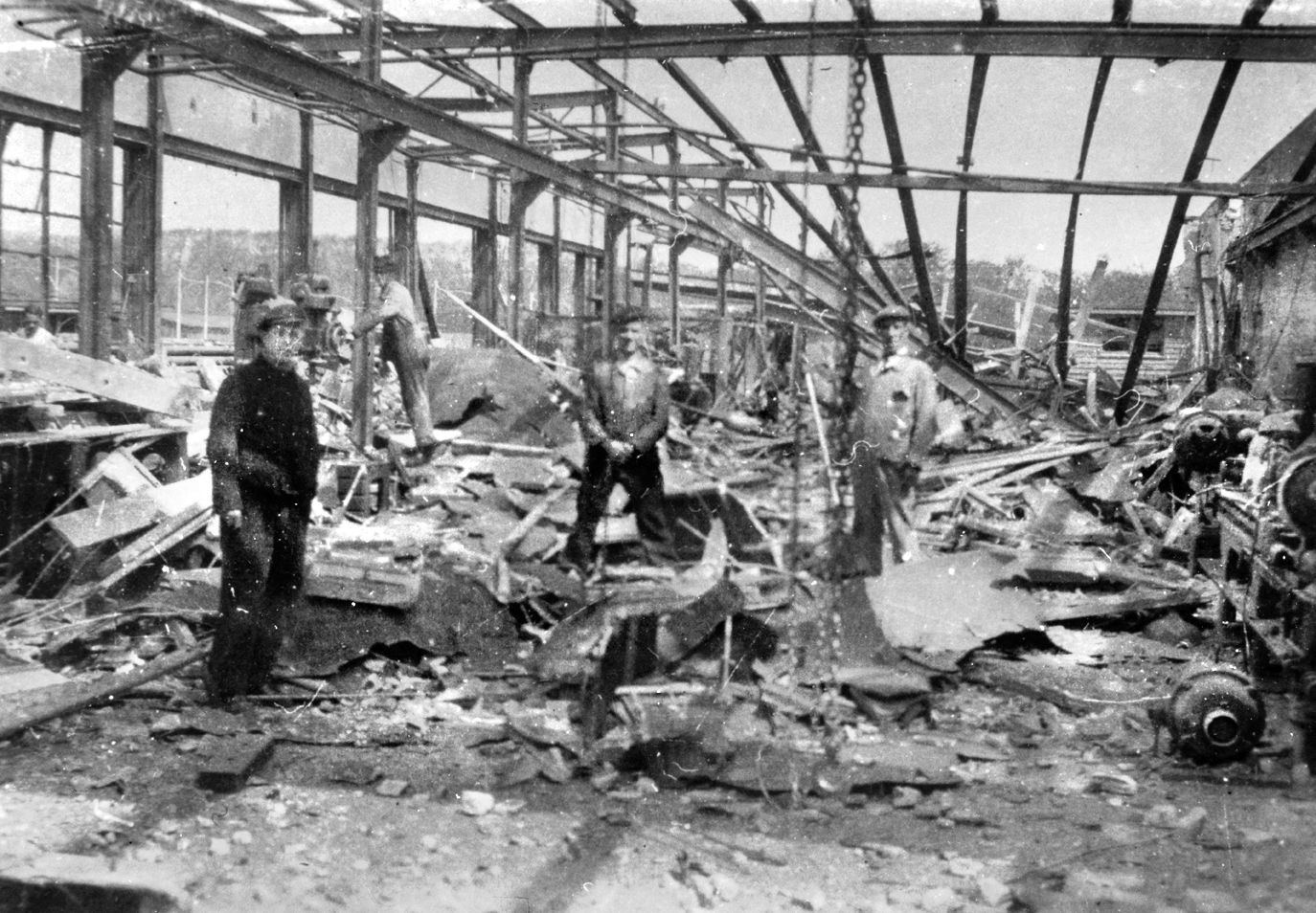 Civilians inspect a factory that was apparently hit during Stillman’s May 14 attack despite RAF reconnaissance photos taken the day after the raid that seemed to show no damage done. 