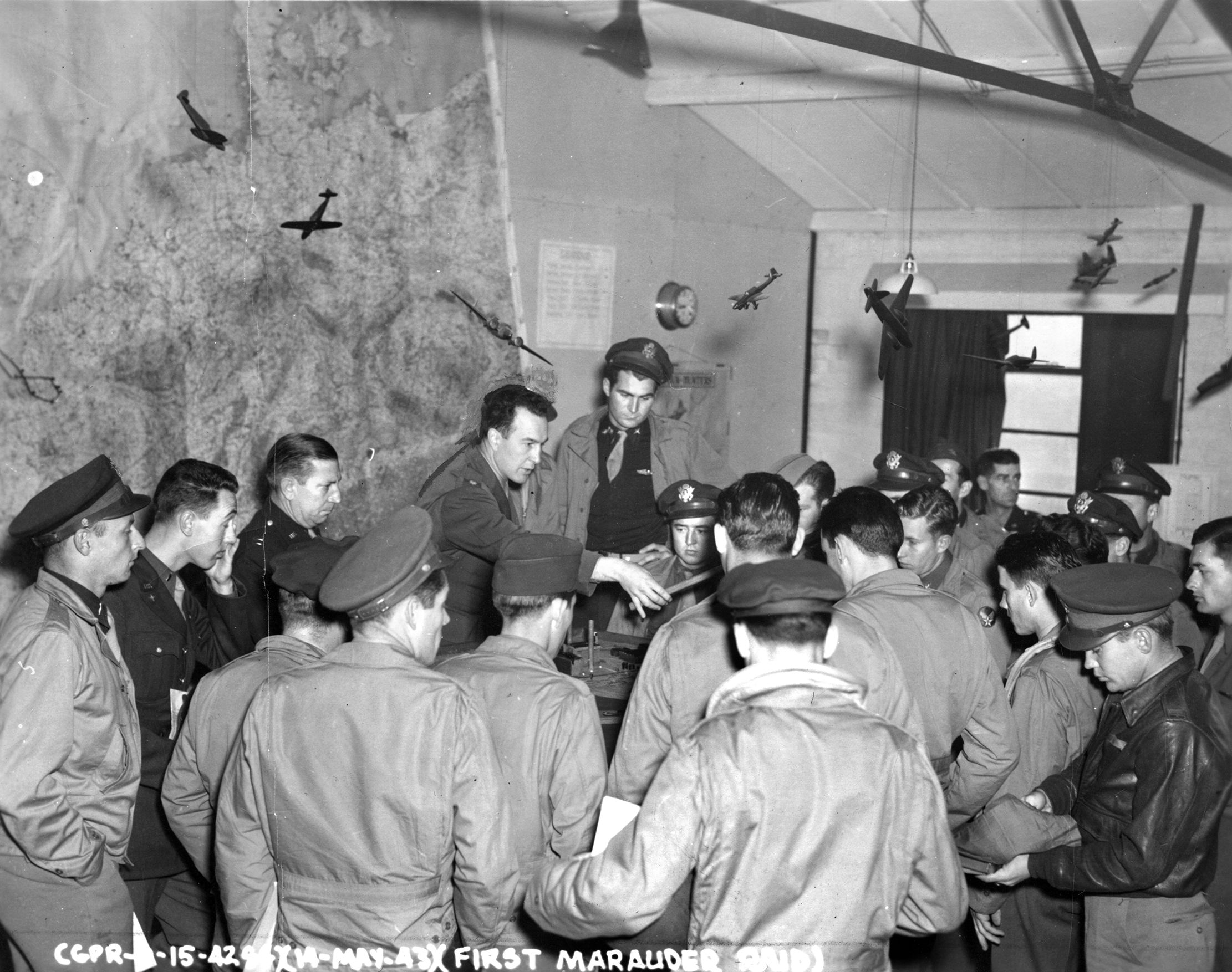 Shown briefing his men, Lt. Col. Robert Stillman, CO of the 322nd Bomb Group, was shot down on the May 17 raid, severely injured, and spent two years in a POW camp. He later became the first commandant of the U.S. Air Force Academy. 
