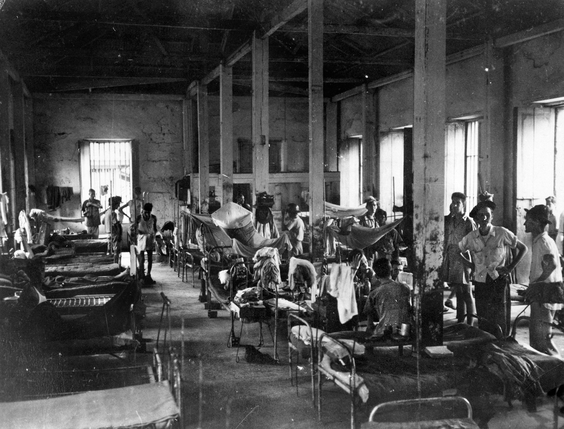 Patients in the hospital ward at Bilibid Prison in Manila. Joe was sent here after a beating for attacking a guard and saved himself by pretending to be insane.