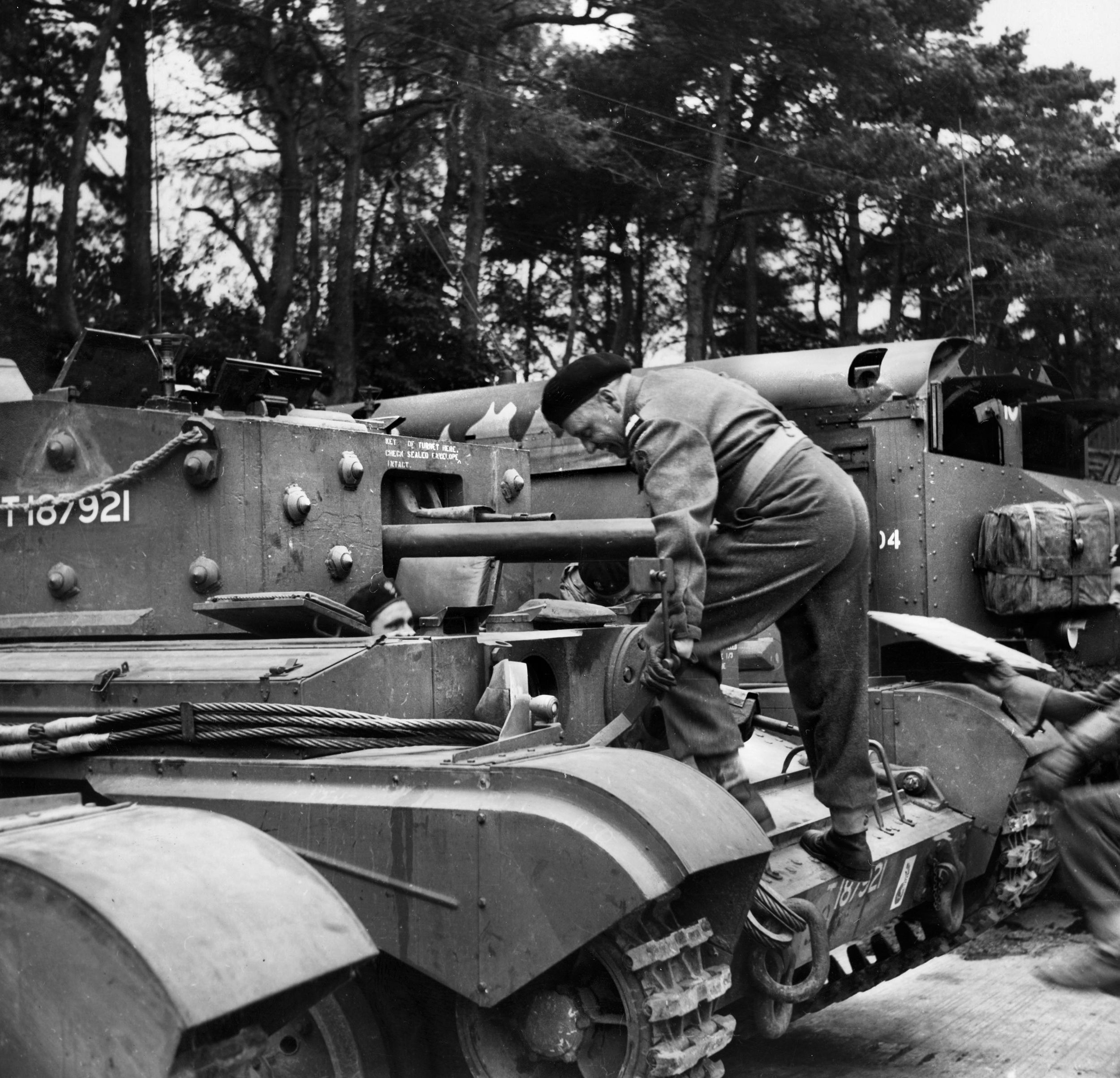 Maczek climbs aboard his Cromwell tank during training in England. The Poles were equipped with both British and American tanks and other vehicles.