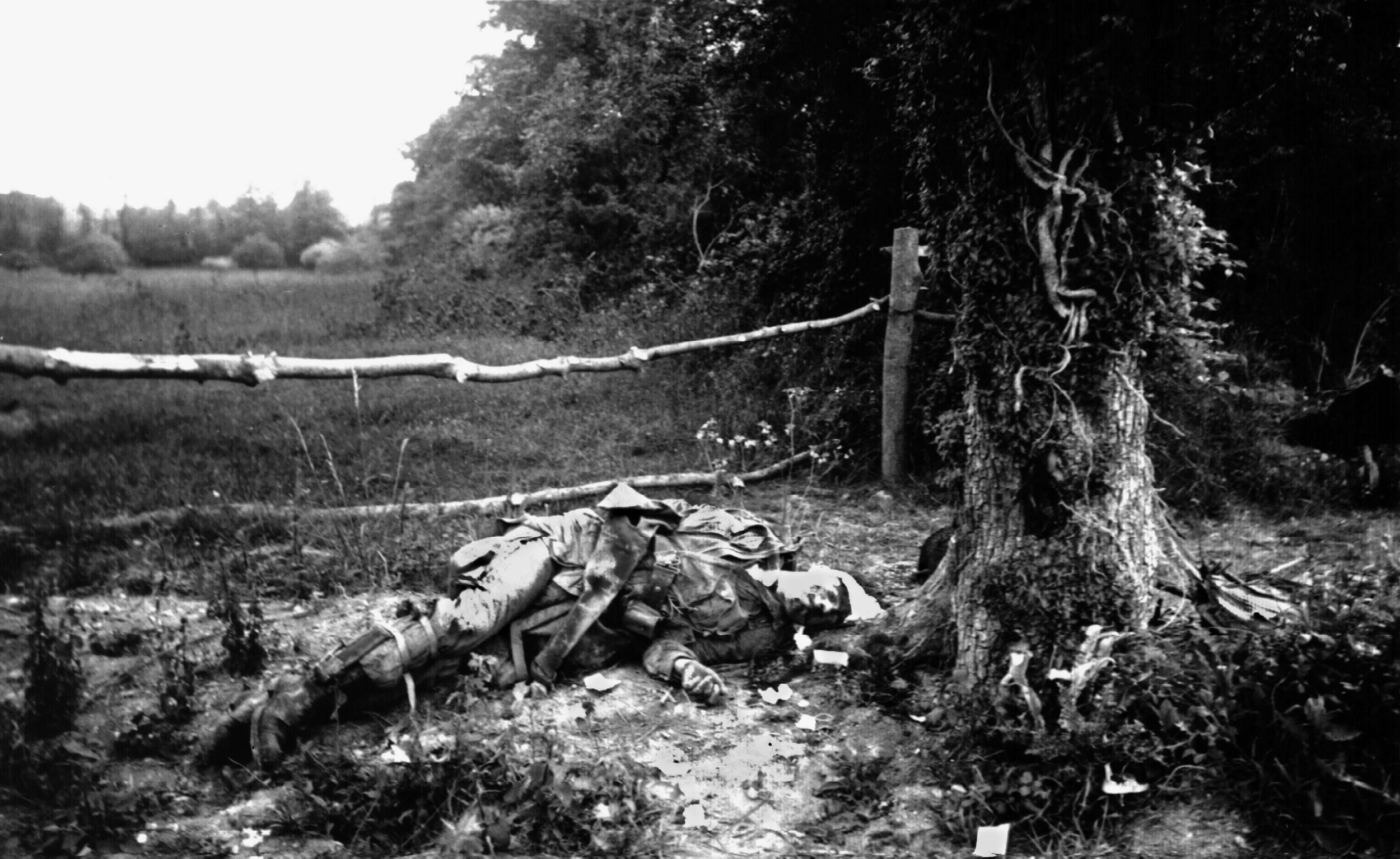 The body of a fallen American paratrooper mutely speaks of the courage and carnage that took place in and around Carentan from June 6 to the 20th, 1944. Although hit hard, Speirs and his men accomplished their mission
