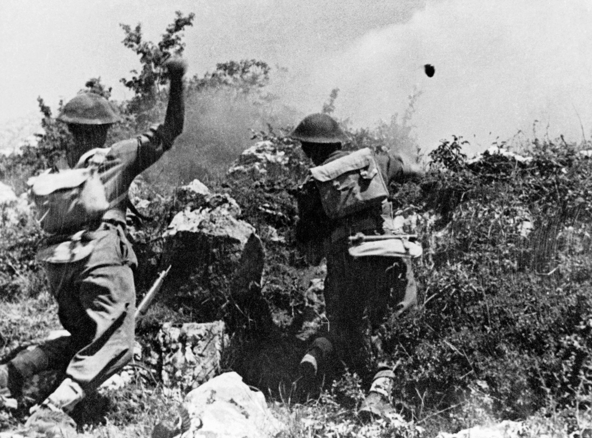 Attacking a German position near the monastery with grenades, Polish troops work their way to the summit.
