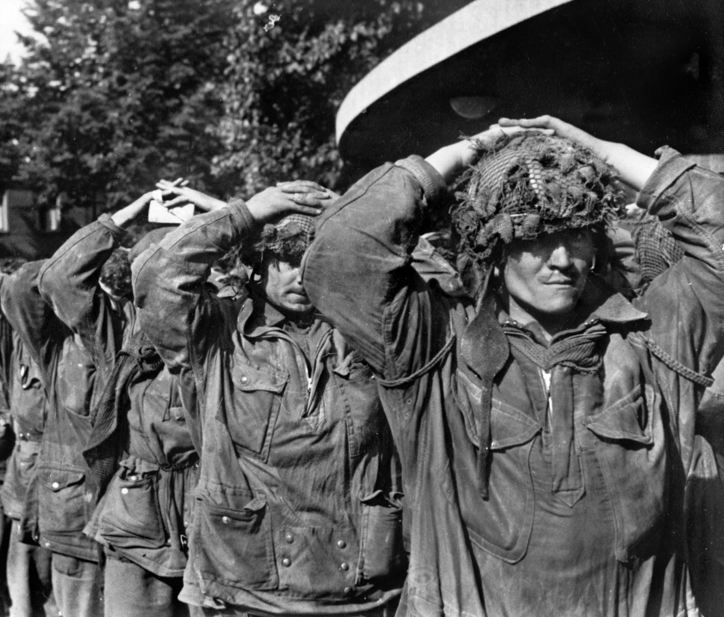Their hands on their heads, British paratroopers of the 1st Airborne Division taken prisoner at Arnhem are marched into captivity. The failed attempt to seize the bridge across the Lower Rhine at the Dutch town sealed the fate of Operation Market-Garden.