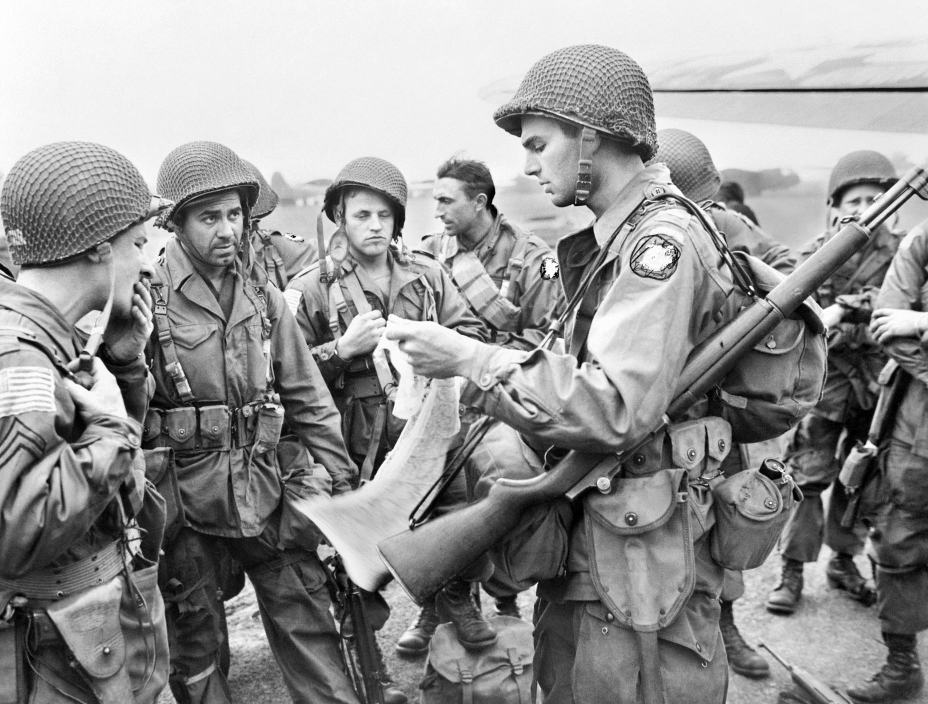 American airborne soldiers receive a last-minute briefing before embarking in the early hours of Operation Market-Garden. The U.S. 82nd and 101st Airborne Divisions participated in the airborne phase, linking up with the British 30th Corps once they were on the ground. 