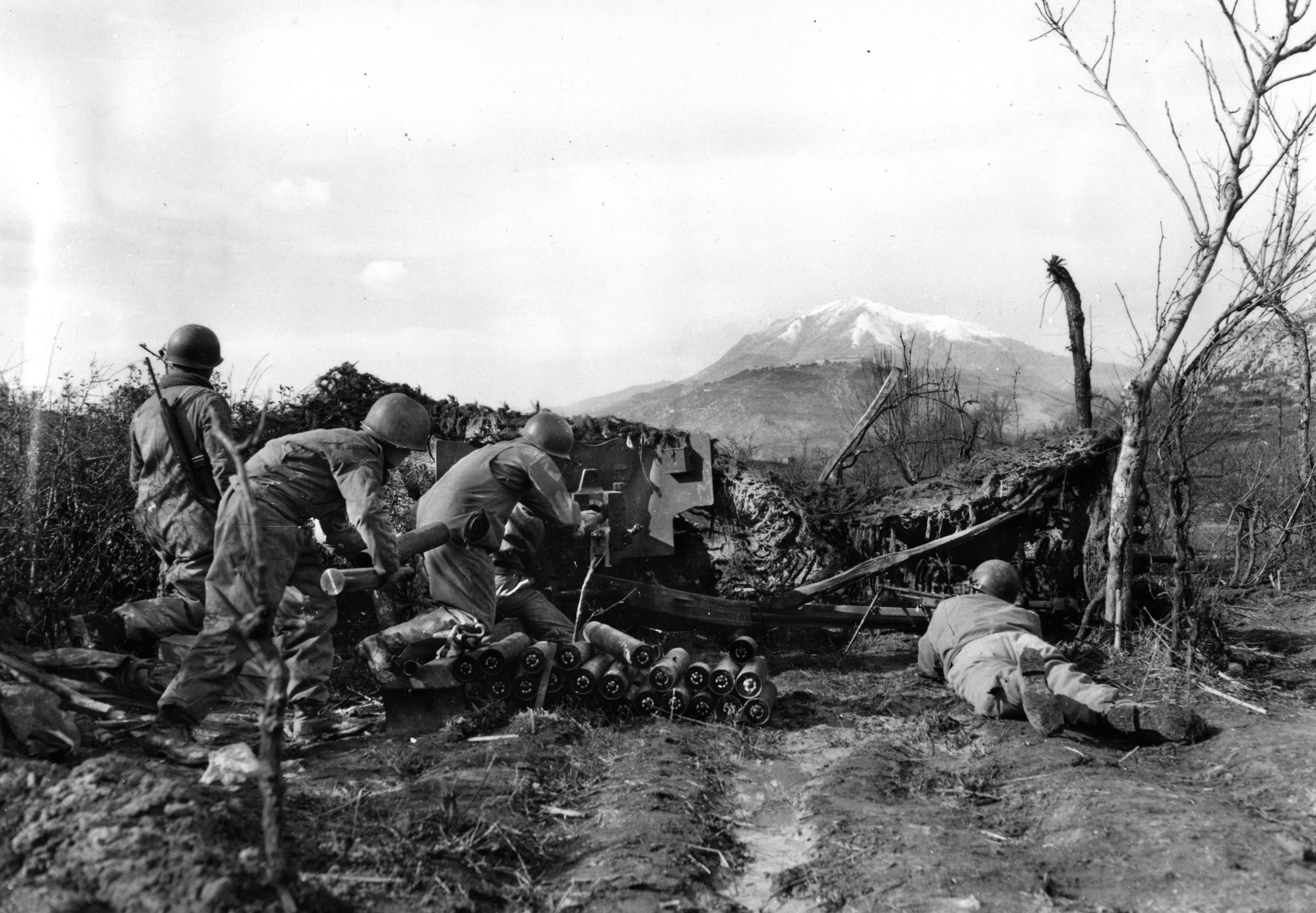 Soldiers of the 36th Infantry Division fire an antitank gun on the Rapido River in February 1944 during the Italian Campaign.  The attempt to cross the Rapido was costly to the American forces.