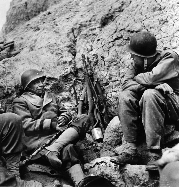 General Roosevelt  talks with a young American officer during a lull in the fighting around the town of Monte Cassino. During the Italian Campaign Roosevelt was attached to the French Expeditionary Corps as a liaison officer.