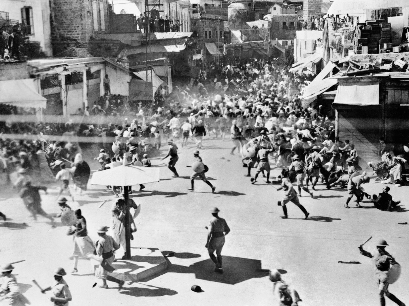 Club-wielding British troops force Palestinian rioters to disperse during a demonstration in 1933.
