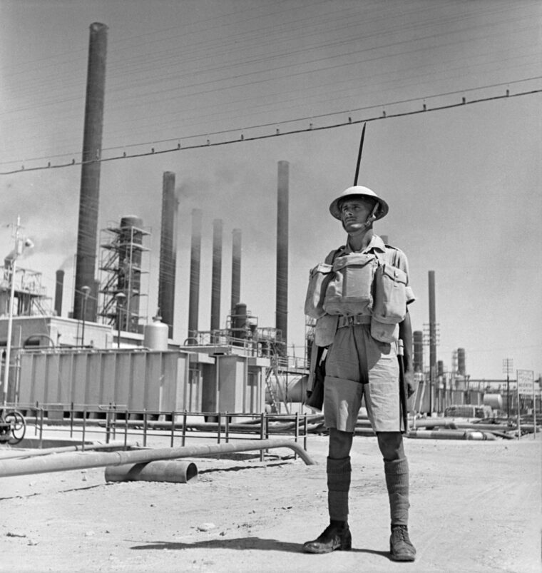 An Indian soldier stands guard at a vital oil refinery near Abadan, Iran, September 1941. 