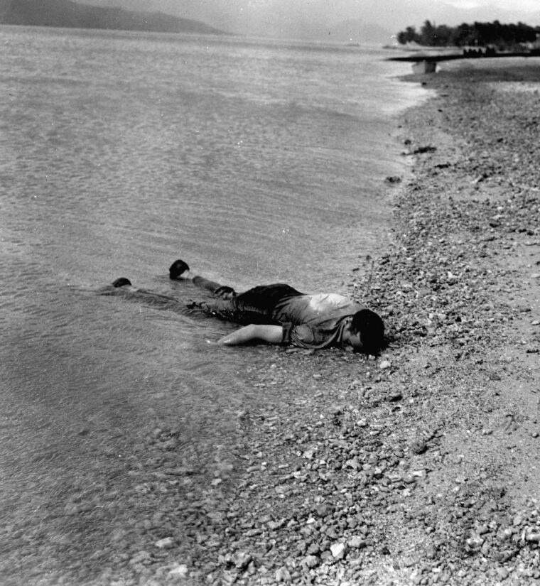  A bluejacket killed during the Japanese attack lies on the beach at Kaneohoe. 