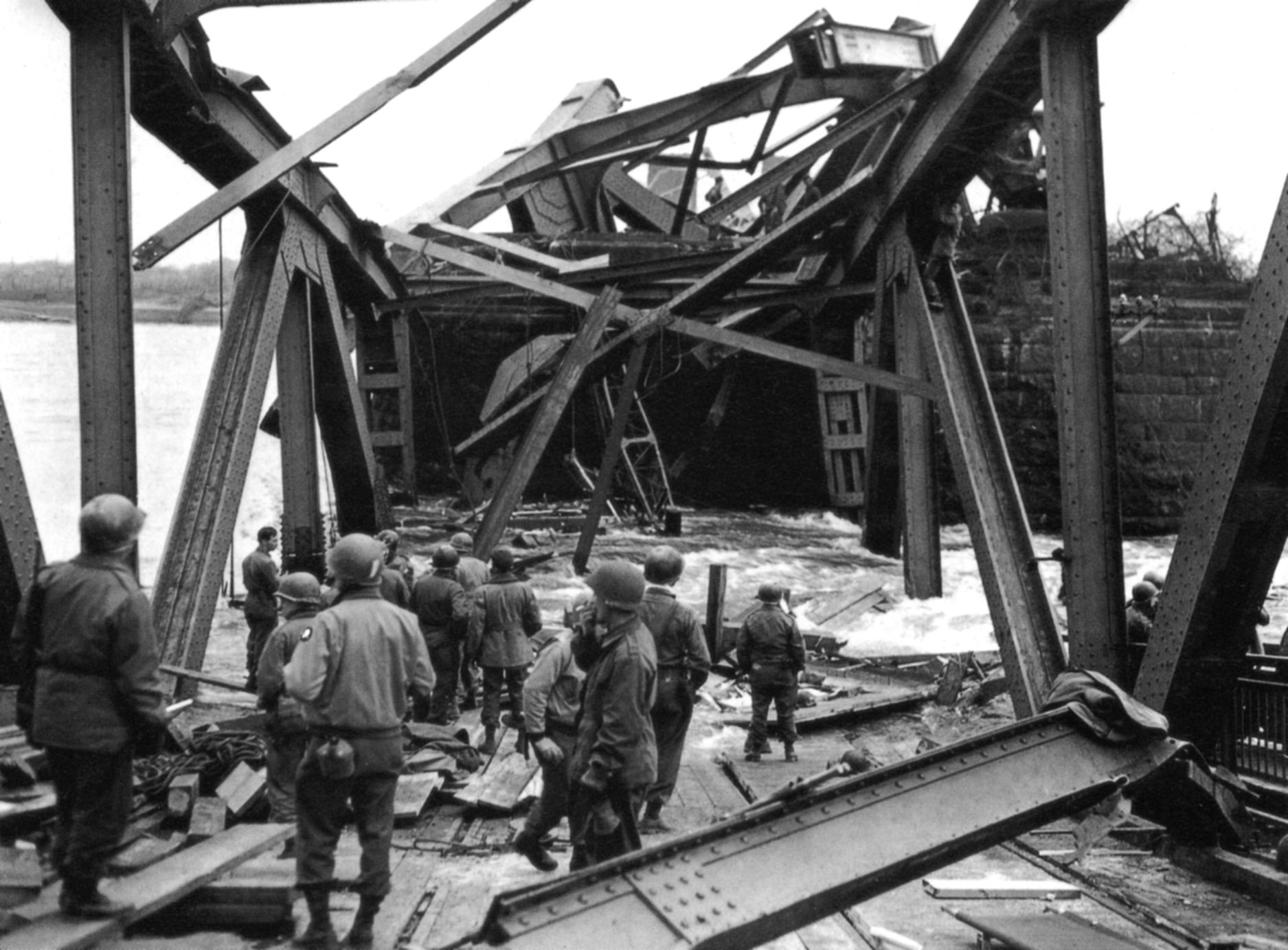 A mass of twisted steel is all that is left of the bridge when it fell into the river on March 17, killing 28 Americans.