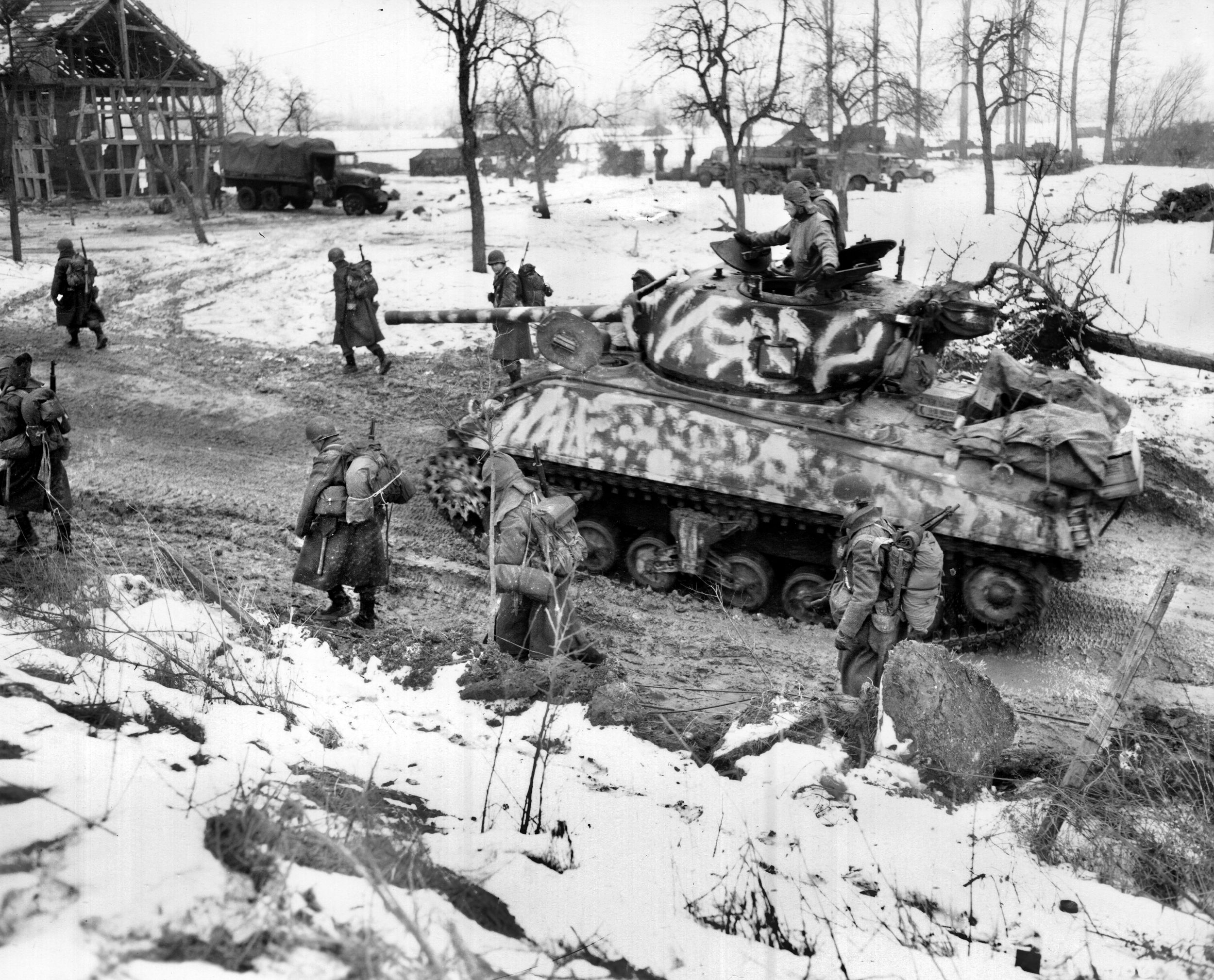 Soldiers of the U.S. 75th Infantry Division tramp through the snow in the Colmar Pocket sector in the Alsace region. The pocket, which consisted of 850 square miles on the west side of the Rhine River, was the last piece of German-held territory on French soil.