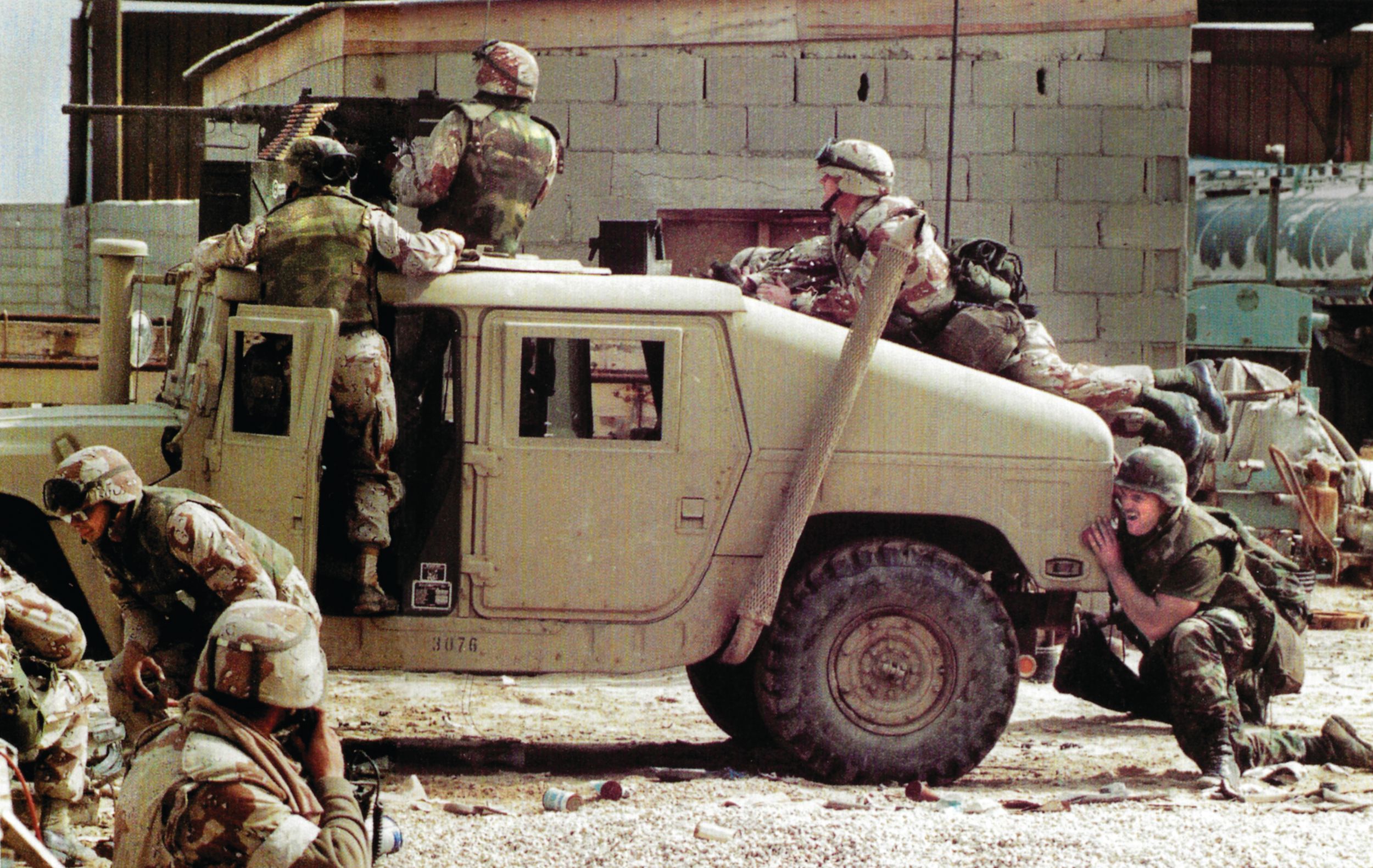 A Marine engages Iraqis with 
the M2 Browning .50-caliber 
machine gun mounted atop a 
HUMVEE during the counterattack at Khafji on January 31. 
Iraq's only ground offensive 
of the war appears to have 
been an attempt to capture 
Coalition prisoners to gain a 
negotiating advantage.