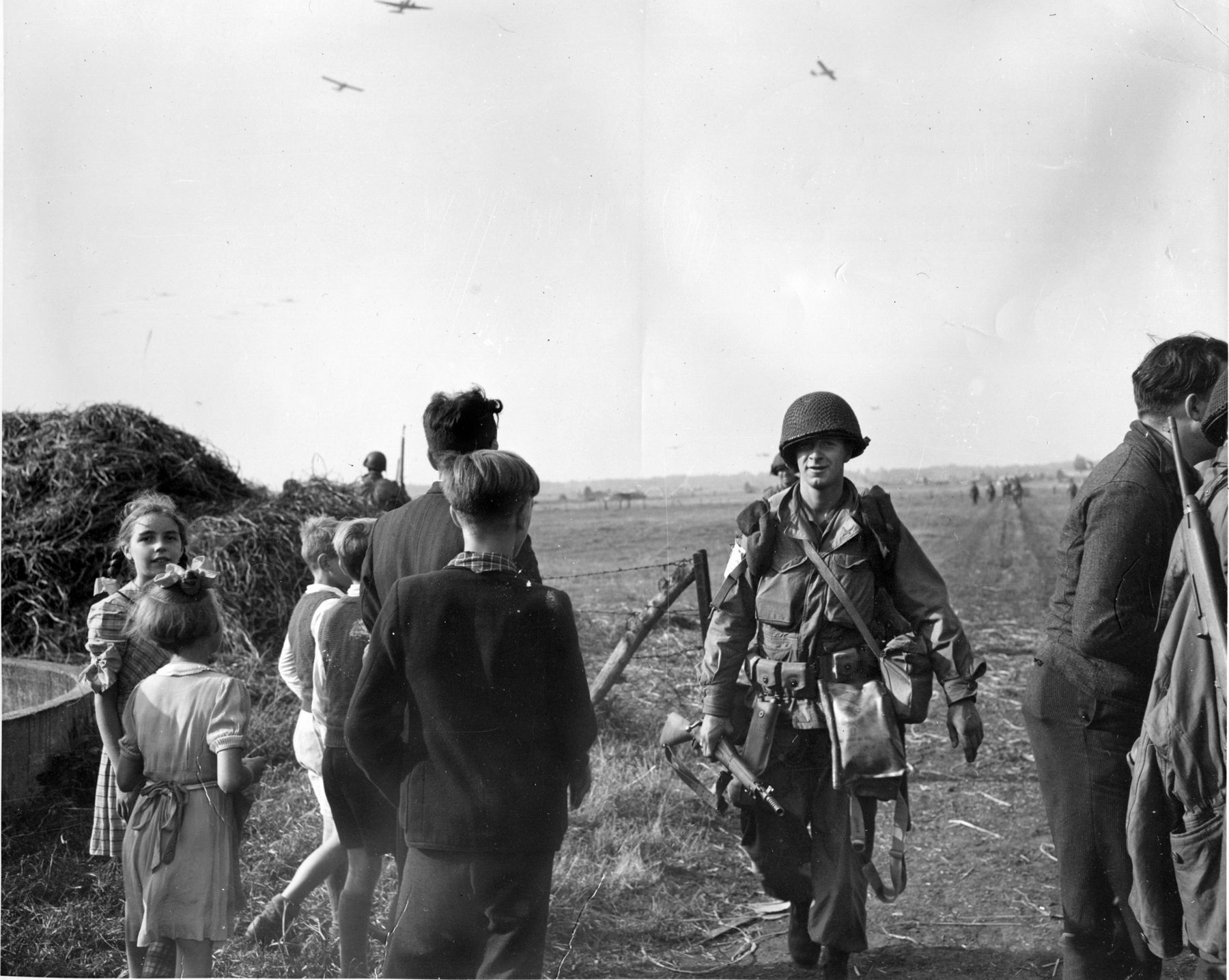 Happy Dutch civilians greet their 101st Airborne Division liberators near Zon, September 18, 1944.