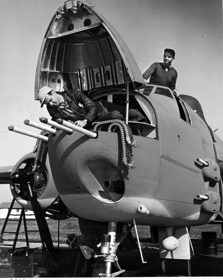 A 75 mm cannon and four .50 caliber machine guns protrude from the nose of this B-25 bomber. 