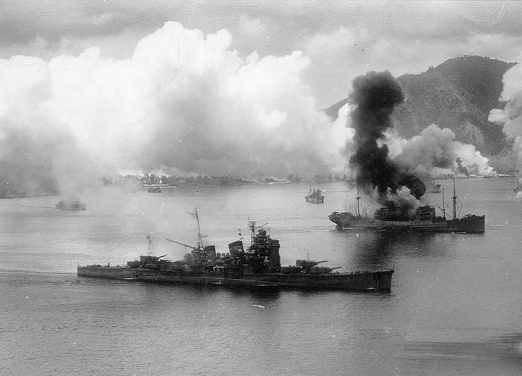 The Japanese heavy cruiser Haguro under air attack by the 3rd Bomber Group in Simpson Harbor, Rabaul, during the November 2, 1943 raid. Note the 9,000 ton transport burning at right.