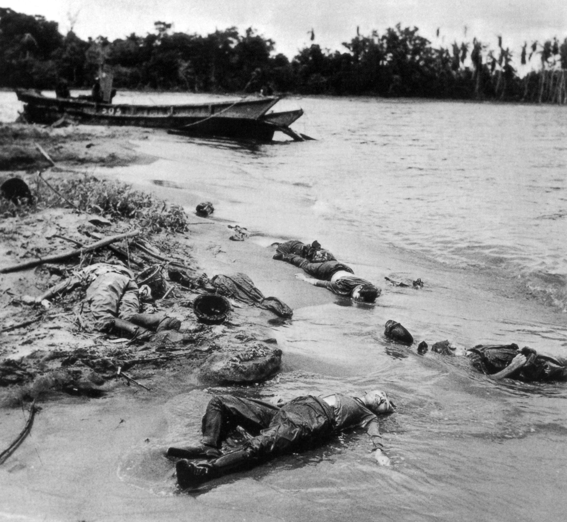 Japanese bodies lie unburied on the beach at Buna after an unsuccessful stand against an American assault.