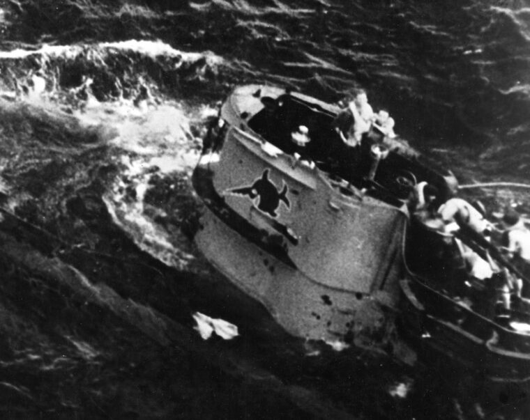 After being attacked by American aircraft on August 9, 1943, the crew of U-664 prepares to abandon ship.