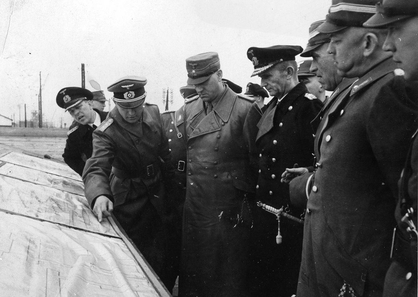 Admiral Karl Dönitz (right), head of the Kriegsmarine, discusses strategy with staff members.
