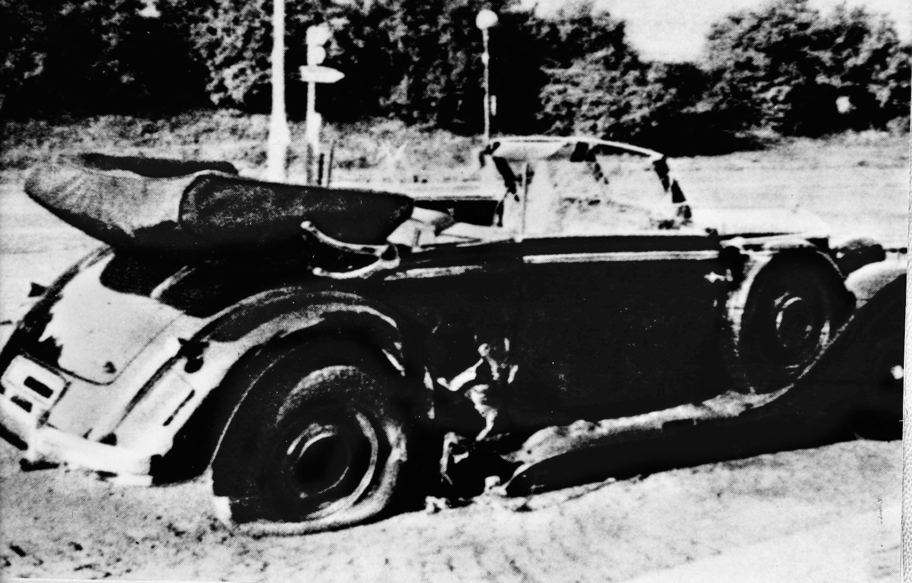 Heydrich’s Mercedes after the attack. The driver’s window was shattered, and a hole was blown in the side behind the door. The passenger door was also blown off in the attack and has been replaced for the photo.