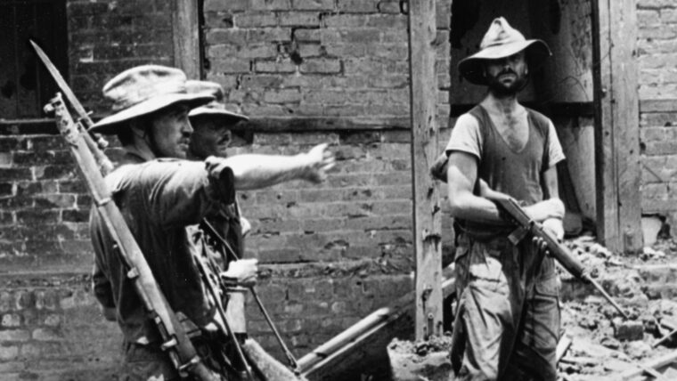 No armchair general, the Enfield-toting Brigadier "Mad Mike" Calvert (left) personally directs operations of his "Chindits" during the fight for a Burmese village.