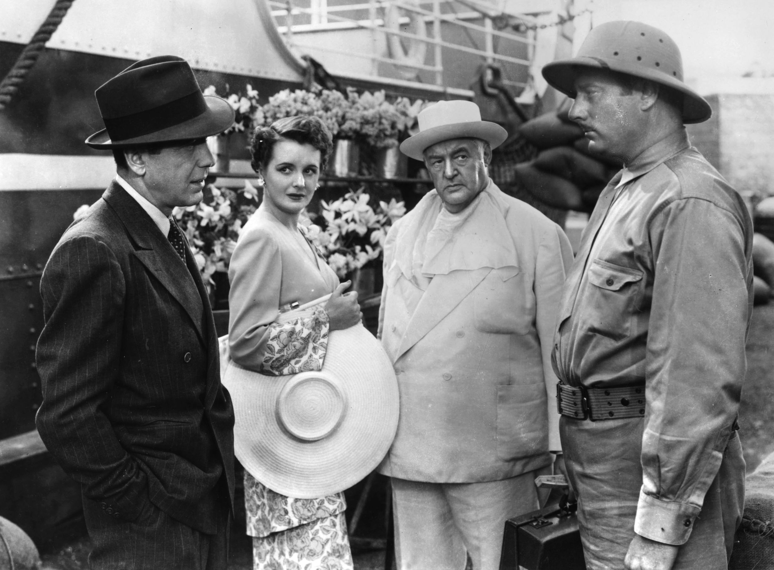 Disgraced Army officer Humphrey Bogart (left) takes on enemy agents, led by Sydney Greenstreet (in white hat), intent on destroying the Panama Canal in Across the Pacific. The 1942 film, directed by John Huston, also stars Mary Astor.