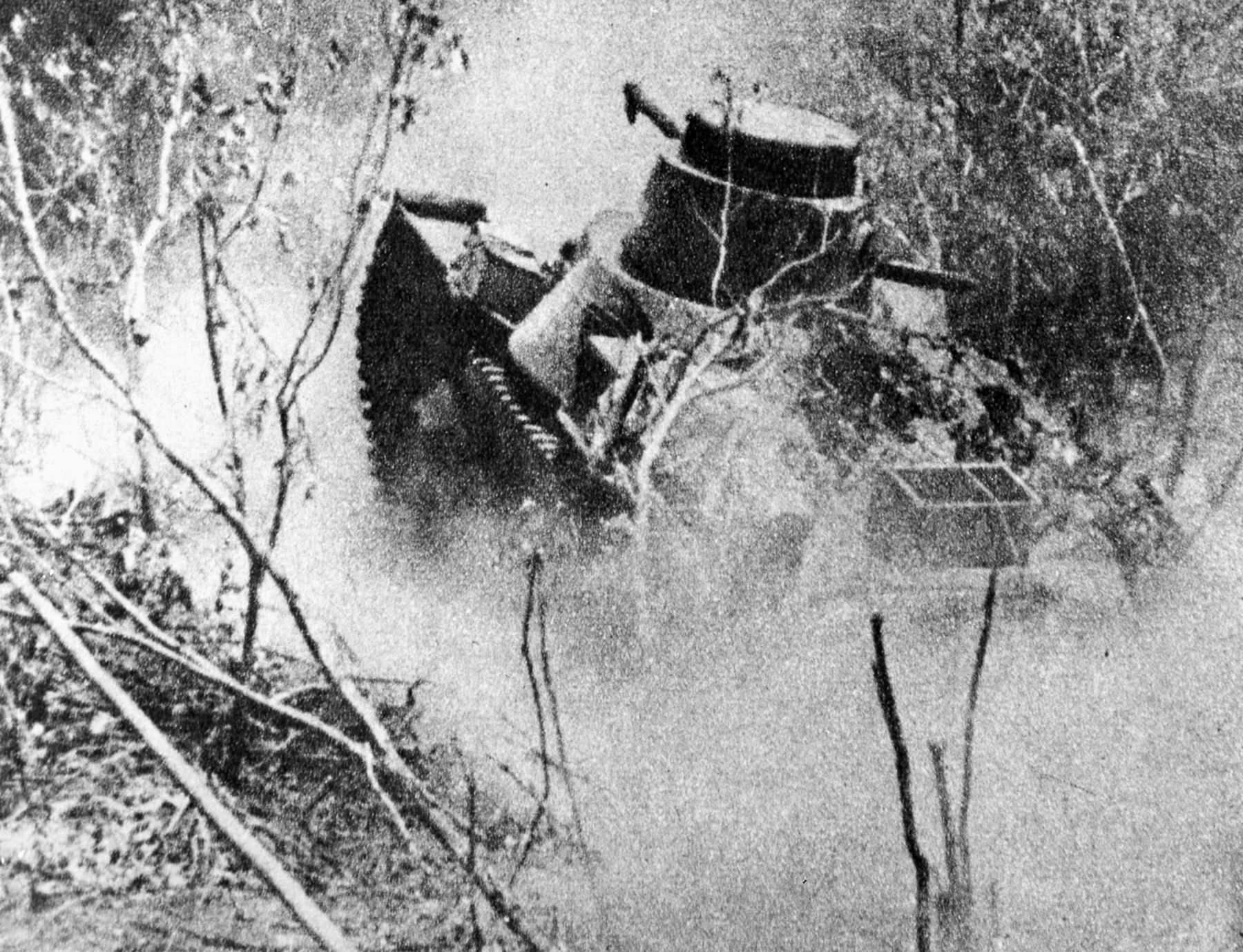 Advancing rapidly through hilly country on the Bataan Peninsula, a Japanese tankette churns up a cloud of dust. Several Japanese armored vehicle types were obsolete by the time World War II began. 