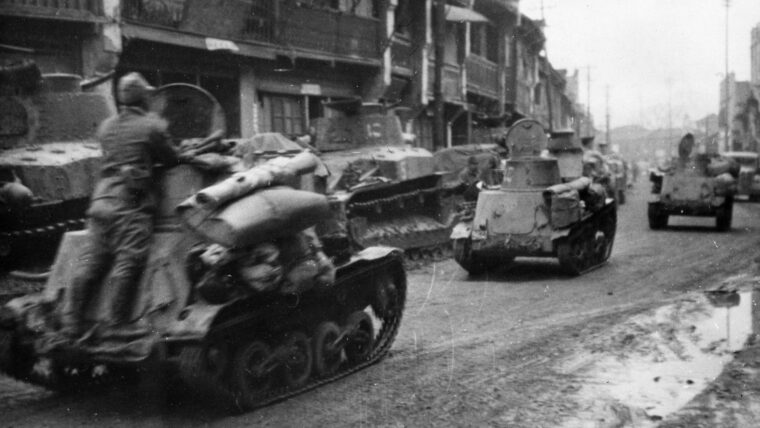 Japanese Type 94 tankettes speed through a village in China. The Japanese military operated in China for nearly 15 years beginning in 1931.