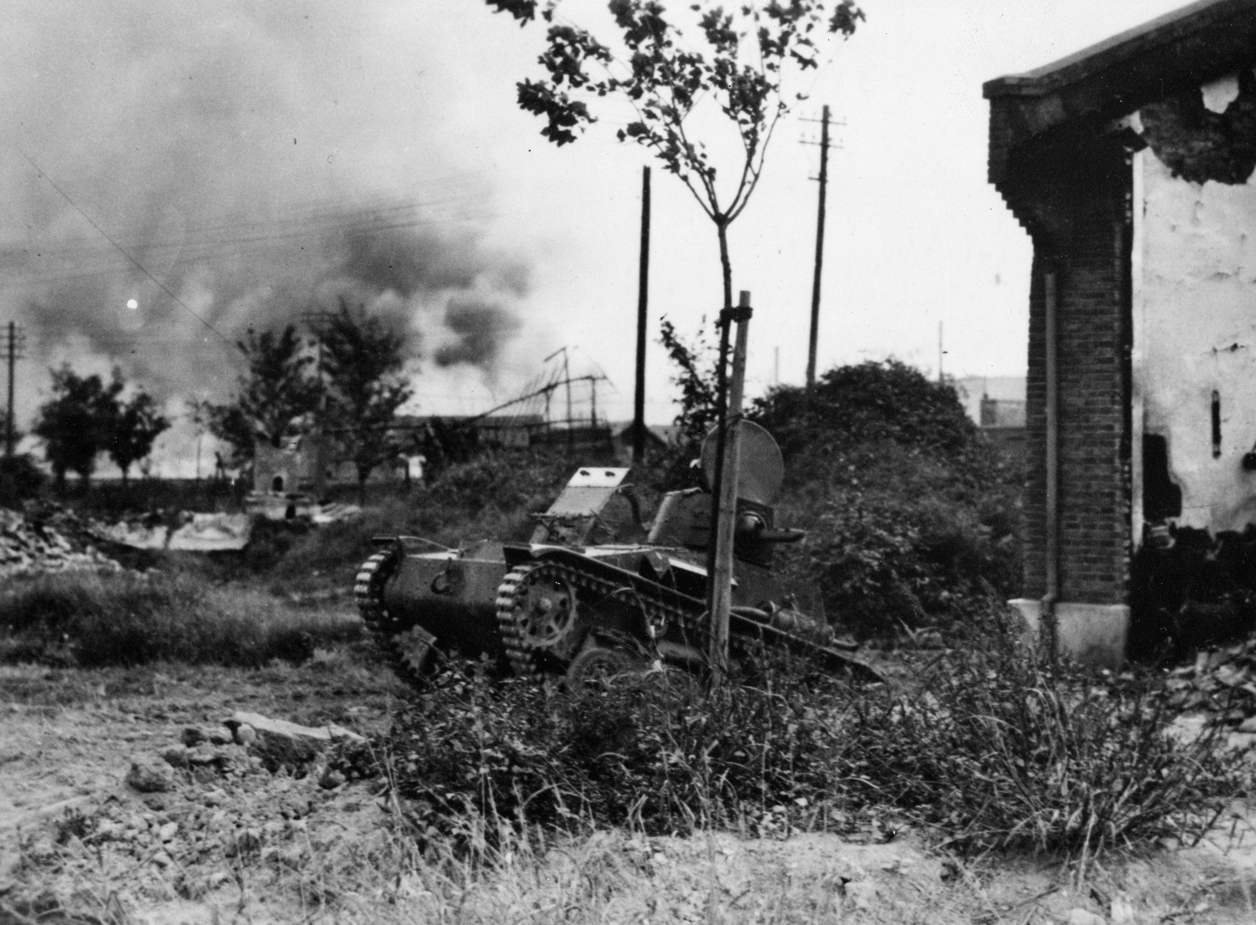 A Japanese Type 92 combat car traverses difficult terrain near the southern Chinese city of Shanghai during the fighting that raged in the area in 1937.