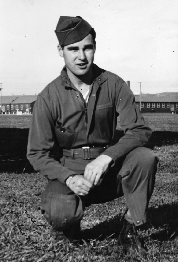 Sergeant Arnold Burton poses in a uniform without any markings. Then-Private Burton was undergoing gunnery training at Lowry Field, Colorado, when the photo was taken.