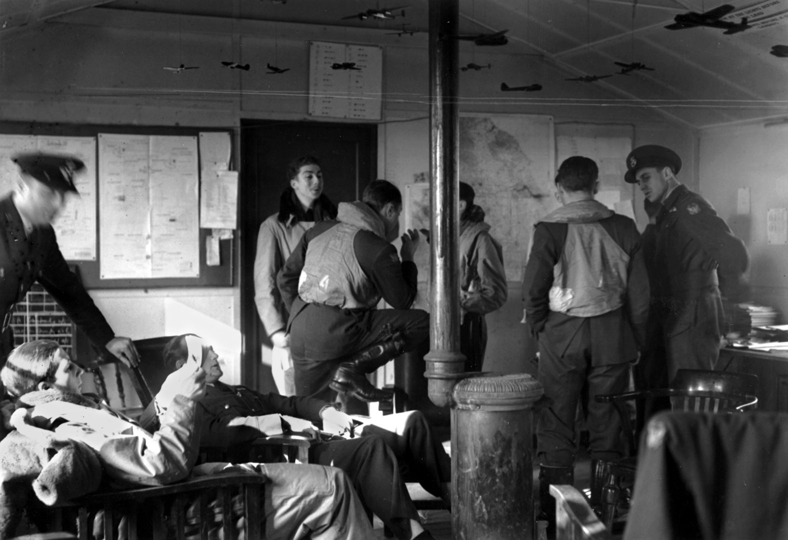 Eagle Squadron pilots relax in the dispersal hut while waiting to make training flights.