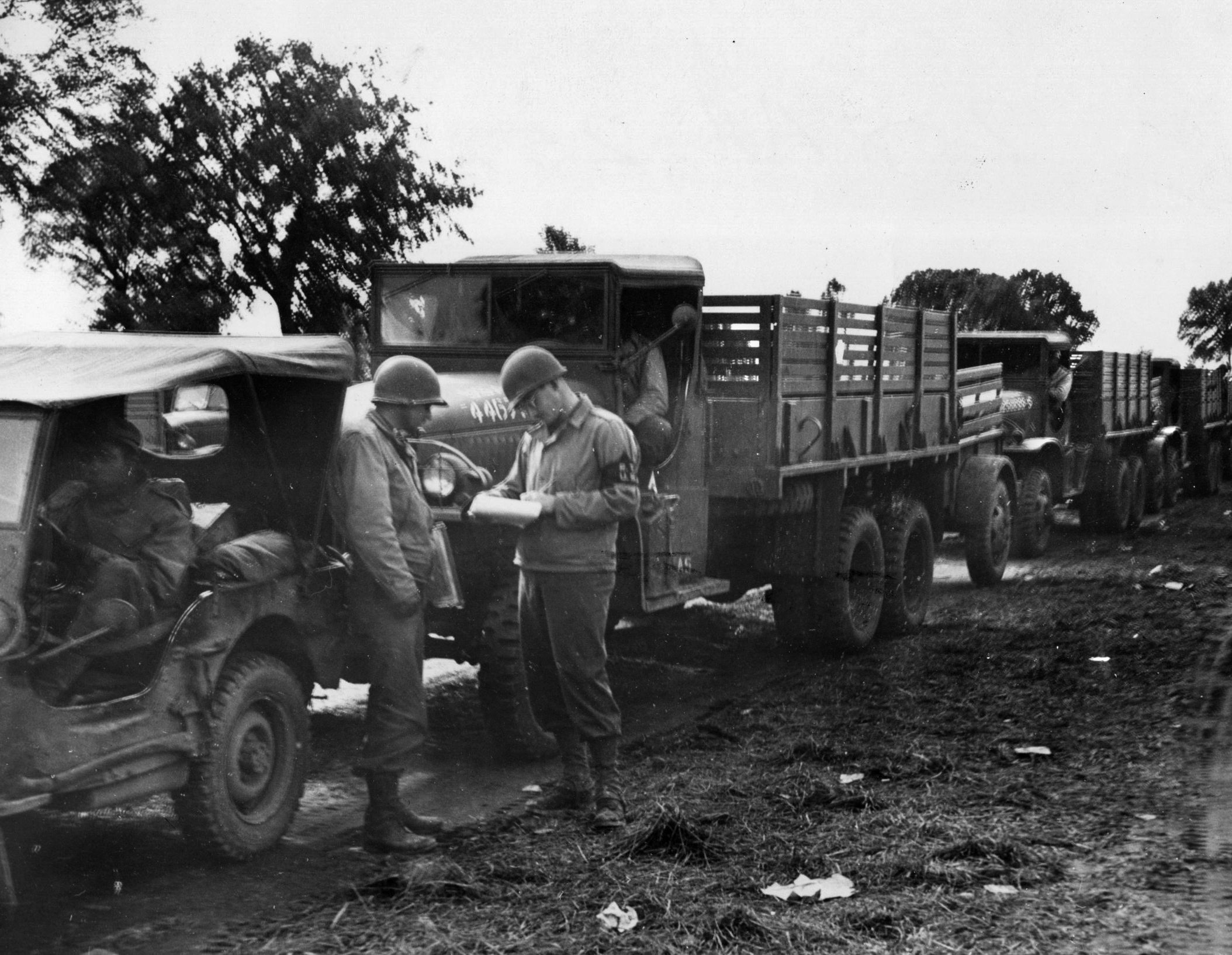 A staff sergeant checks an empty convoy truck at a regulation point in France.