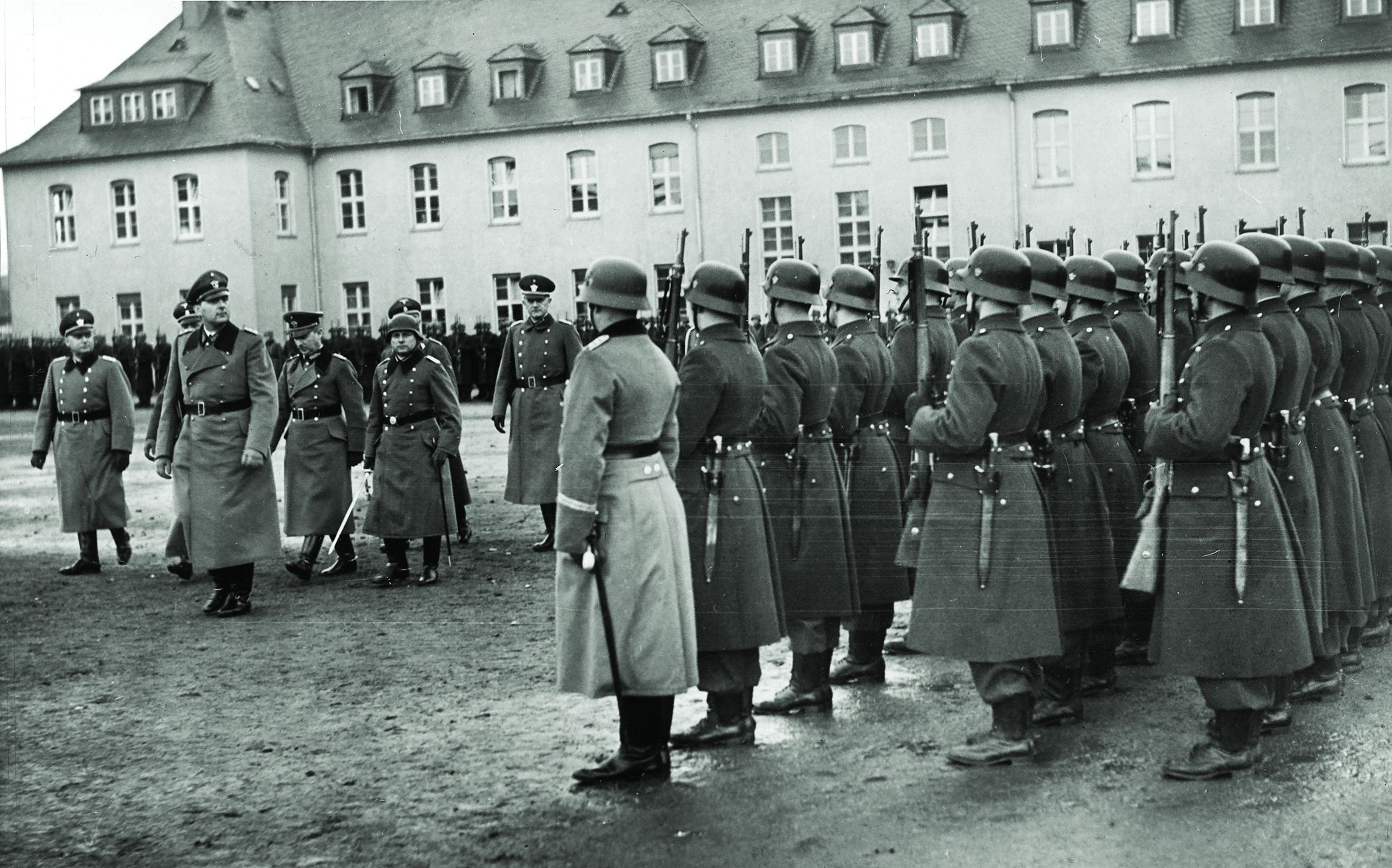 SS General and Police Chief Kurt Daluege reviews troops in Luxembourg, 1940.