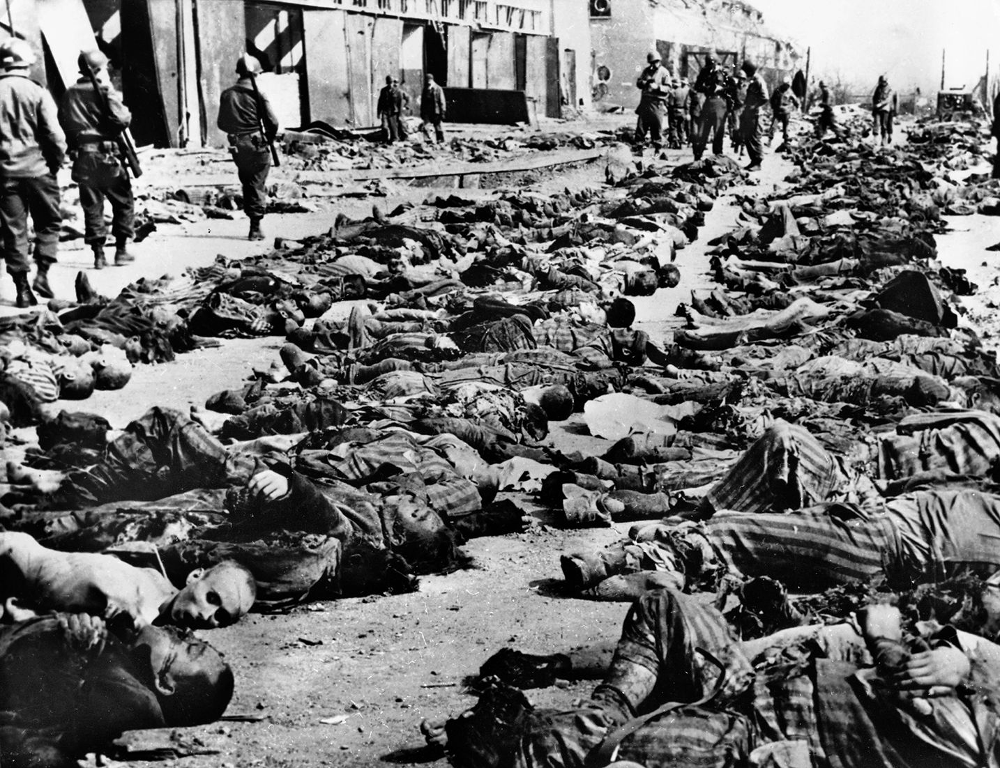 Rows of corpses lie unburied at Buchenwald shortly after Allied military forces liberated the camp. Many of the dead were slave laborers who worked on V-2 rocket assembly at a nearby facility.