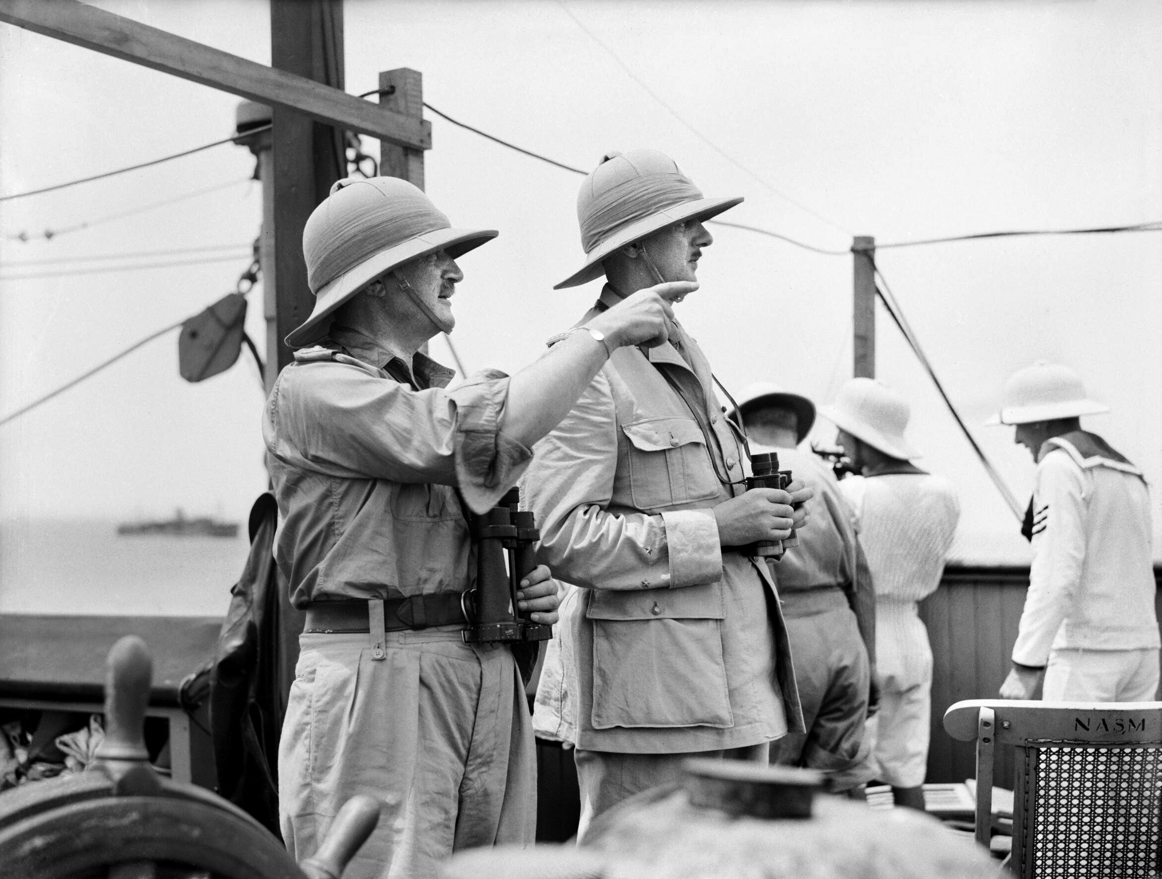 British liaison Edward Spears and Free French leader Charles de Gaulle watch as the combined Free French and British attempt to capture the Vichy-controlled port of Dakar, Senegal. The operation on the coast of West Africa was an embarrassing debacle. 