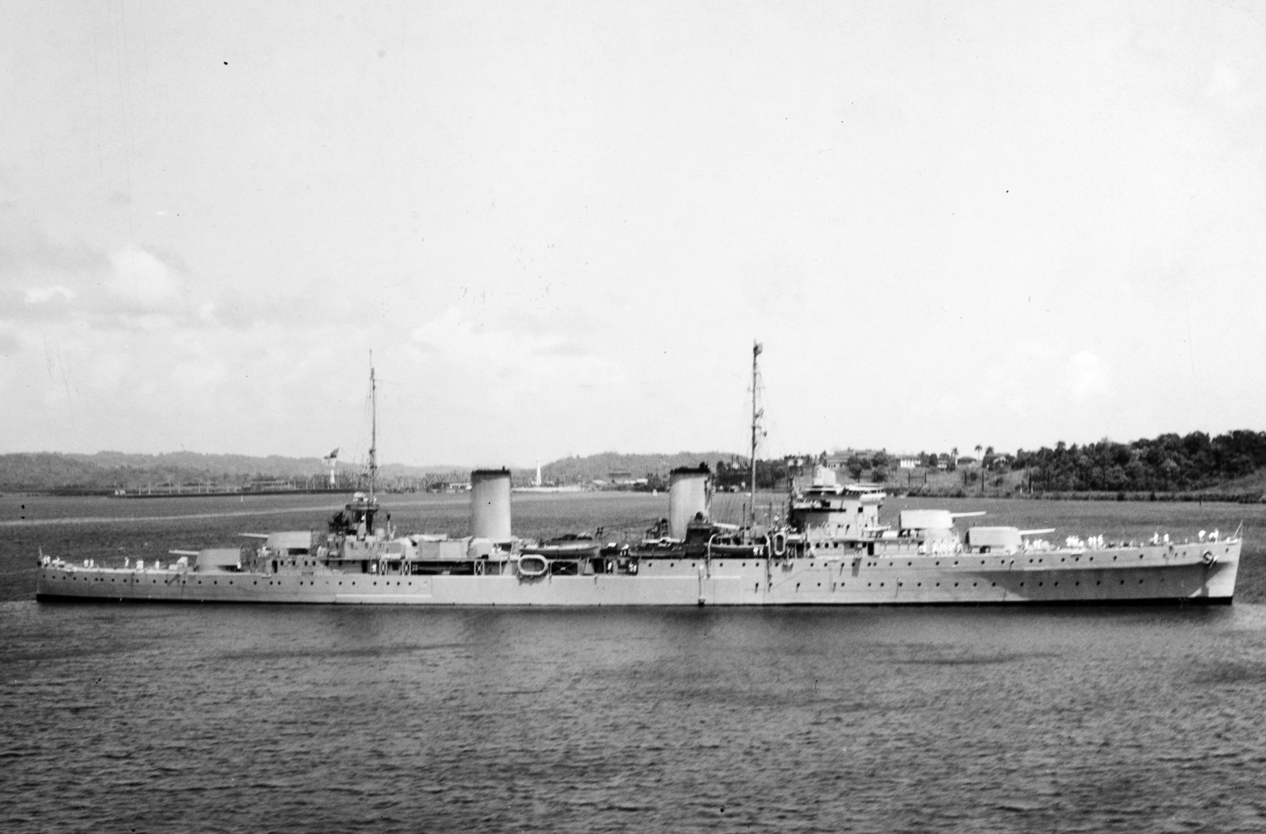 The cruiser HMAS Perth is shown at anchor during peacetime.