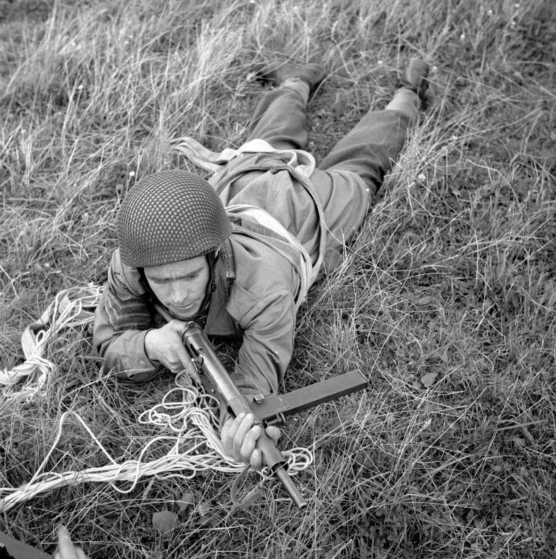 A paratrooper with the 2nd Parachute Battalion takes part in combat training. Paras conducted the Bruneval Raid to seize components of a new German radar system from a post in the coast of France.