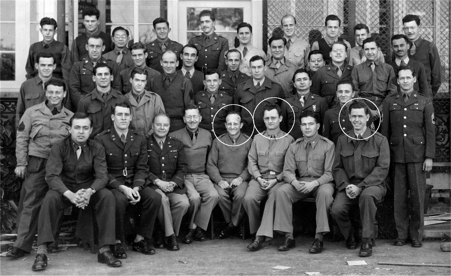 Sergeant Joseph E. Richard sits circled at far right in this photo of U.S. Signal Intelligence personnel at the Central Bureau headquarters in Brisbane, Australia. The other two individuals circled are Colonel Abraham Sinkov (left) and Lt. Col. Harry Clark.