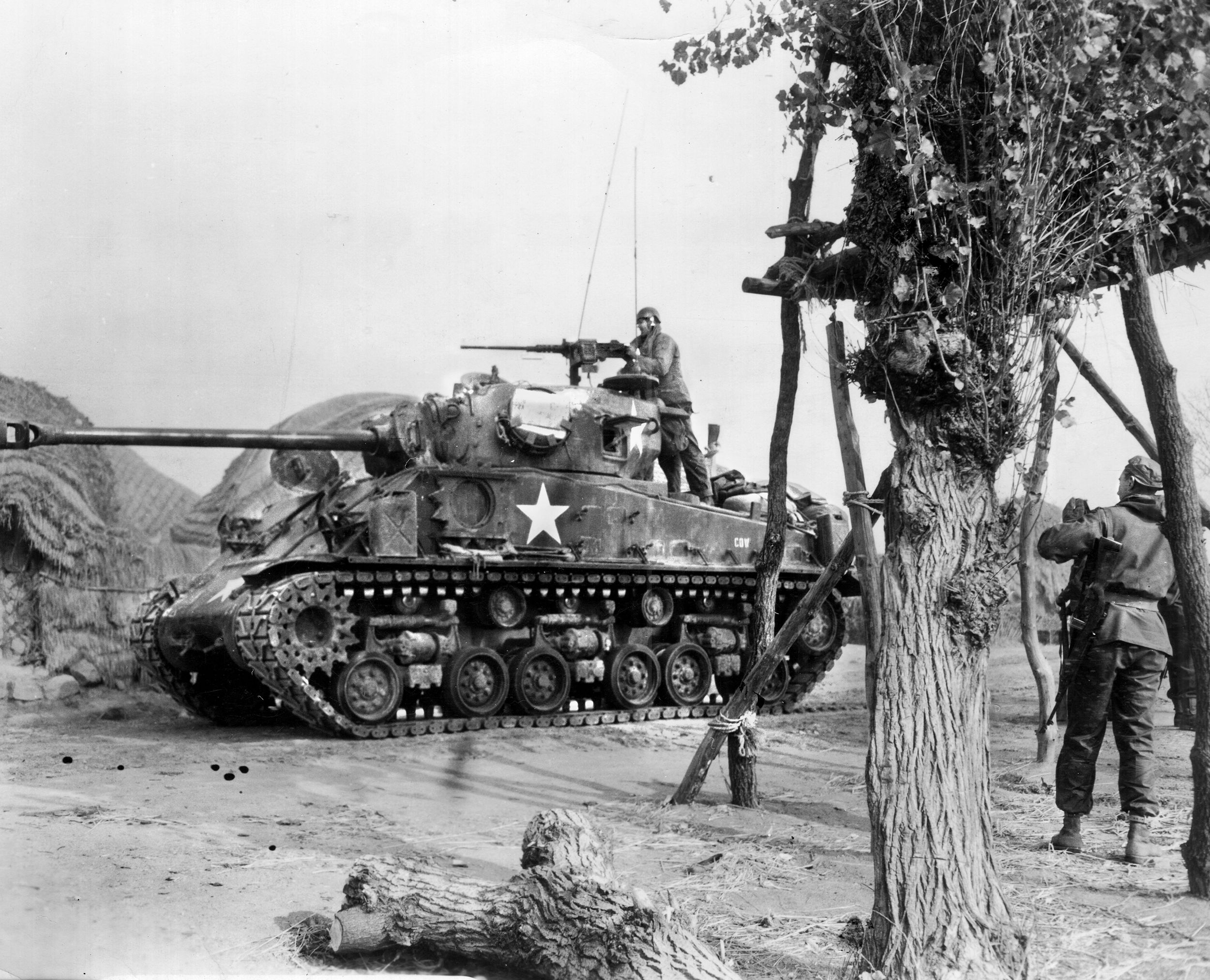 An M4 Sherman of the 89th Medium Tank Battalion accompaning the 61st Middlesex fires on North Korean targets. Though most of the North Korean armor was destroyed by air, the Soviet T-34/85 tanks used by the NKPA were no match for the American Sherman and Pershing tanks.