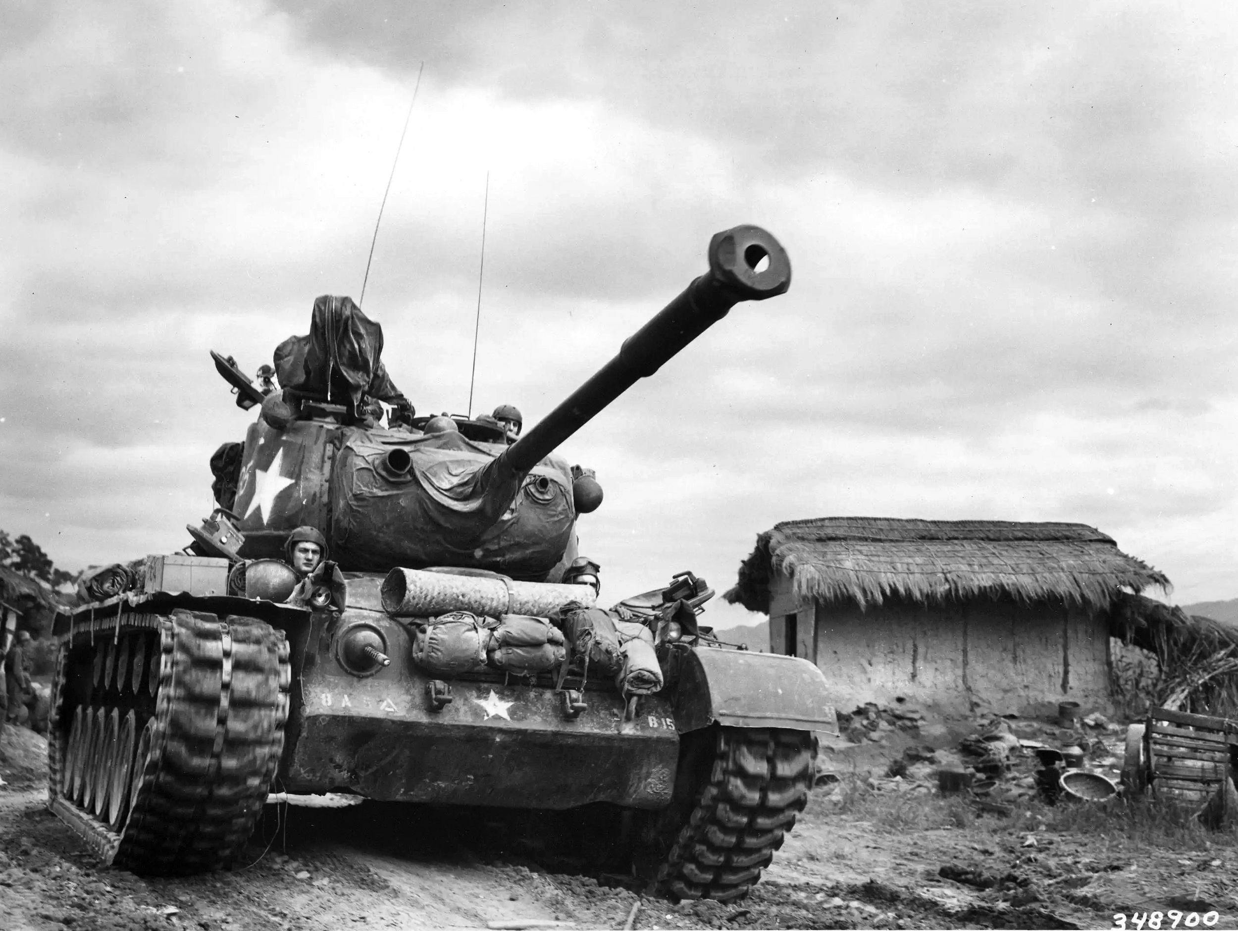 This  U.S. Army tank, identified as an M46 Patton, advances past the village of Kumko in September 1950. The M46 was an improved version of the M26 Pershing and began arriving in South Korea in August 1950.