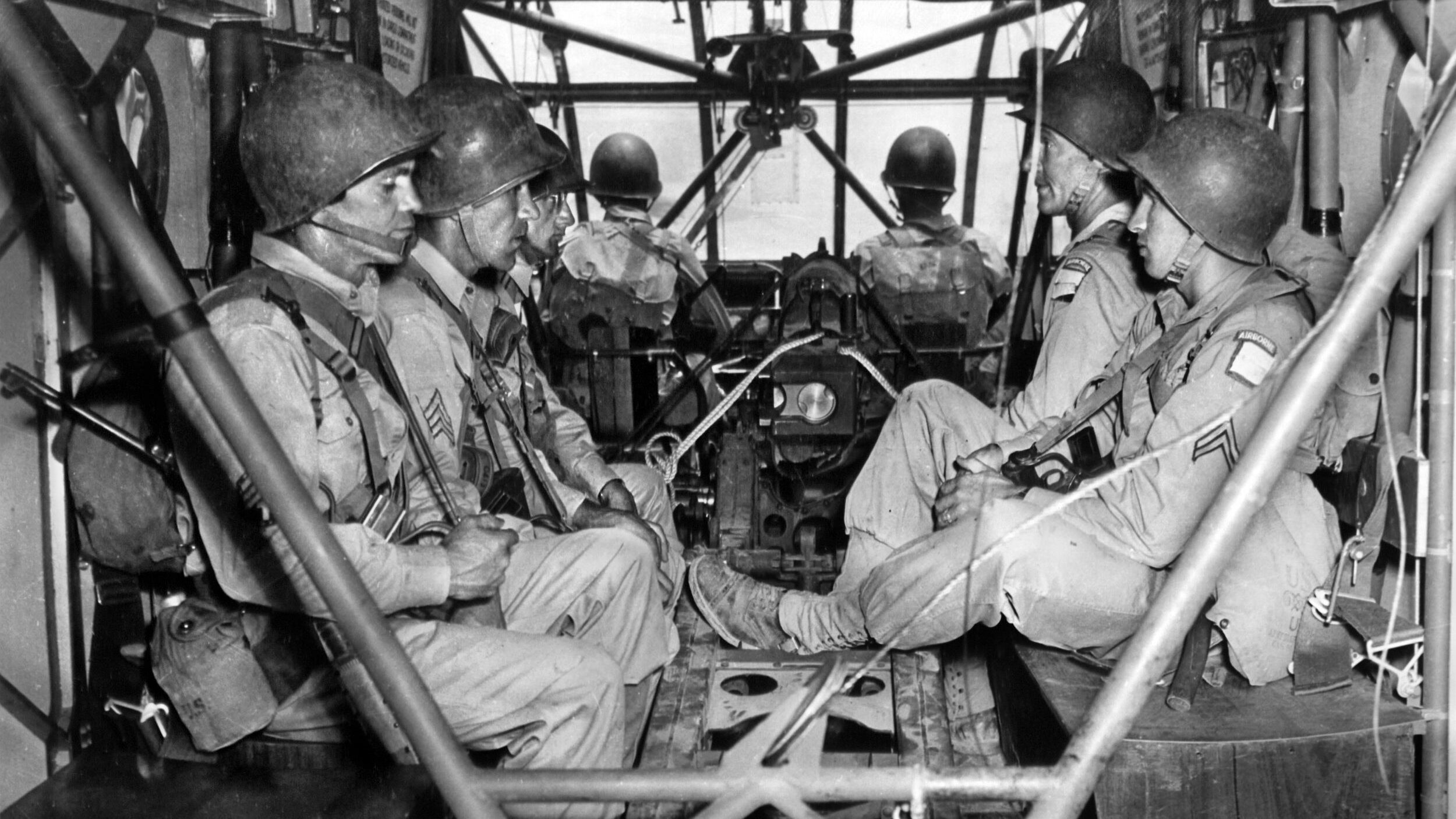 Five 82nd Airborne troopers, plus a pilot and co-pilot, are photographed with a 1,439-lb. 75mm pack howitzer inside a CG-4A “Waco” glider during training in Morocco prior to the June 1943 invasion of Sicily. The glider forces sustained heavy losses during Operation Husky.