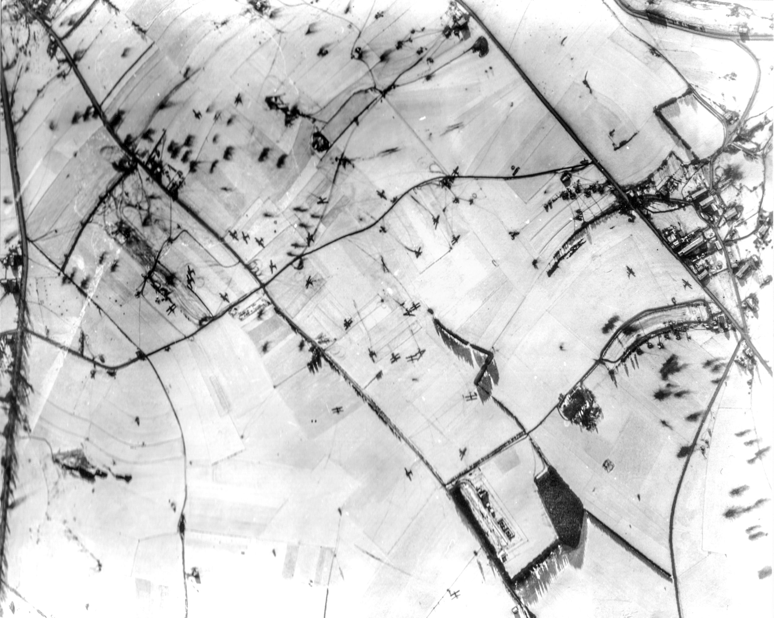 Gliders litter a frozen field near Bastogne during the Battle of the Bulge. Despite horrific losses, glider pilots delivered 100,000 pounds of cargo in one day to the surrounded troops at Bastogne. Sliding to a stop on frozen farm fields was a harrowing experience.