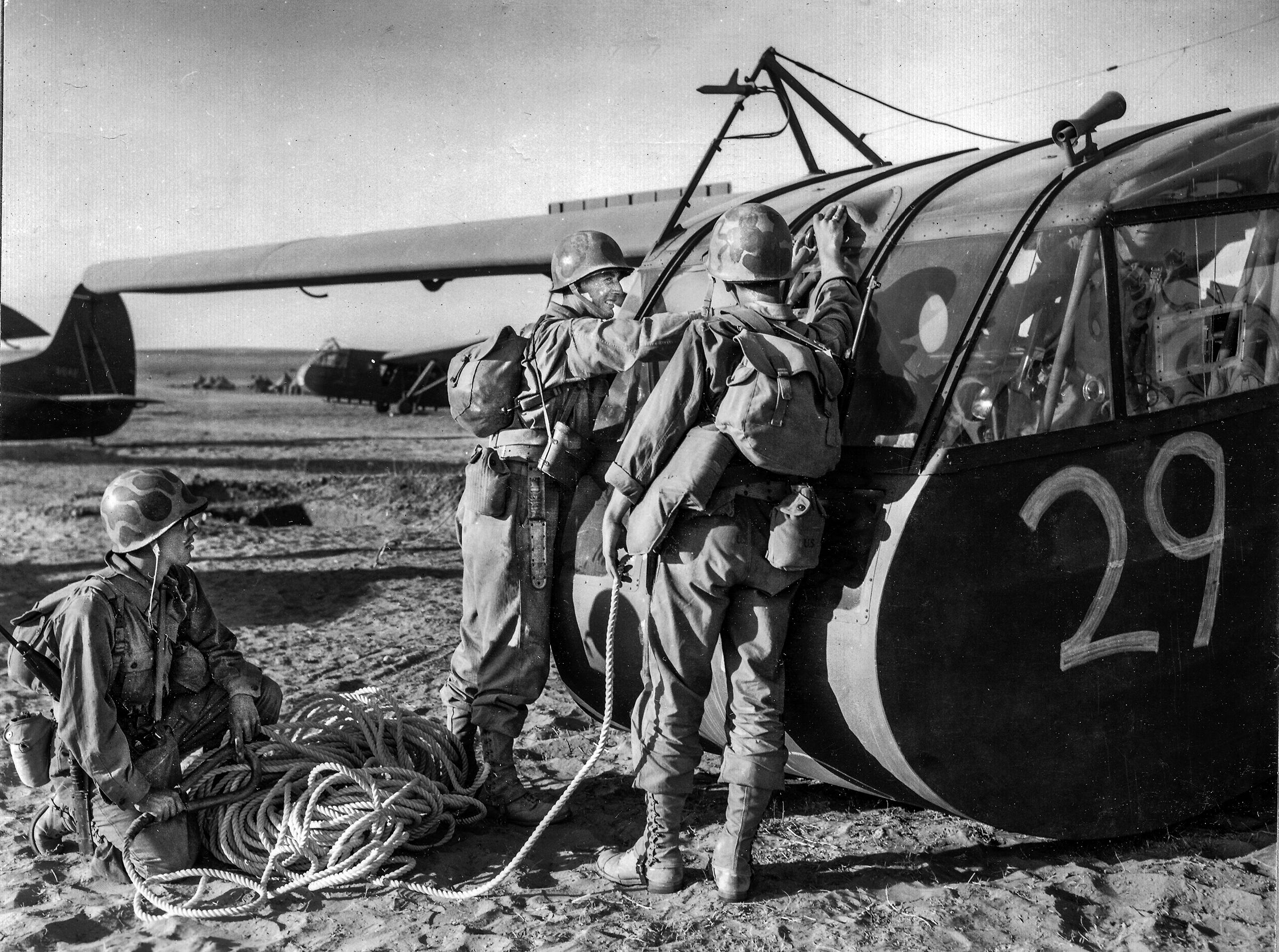 Glidermen attach the tow rope before the invasion of Sicily. Towed at about 120 mph for hours, the glider pilots’ tow rope—attached to the cockpit—was less than one inch in diameter.