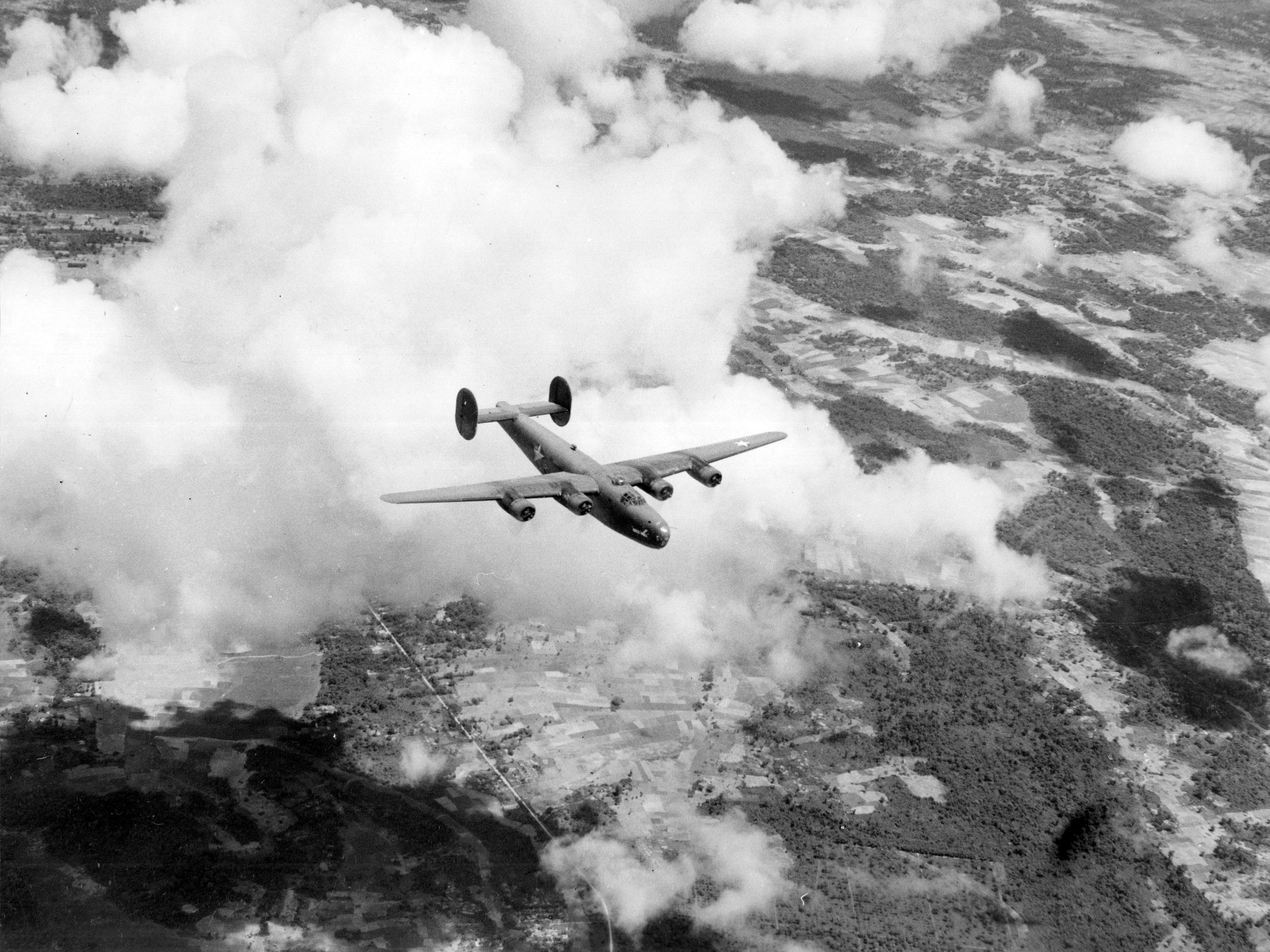 Cargo plane of the India-China Wing Air Transport Command, in flight on its return from China to its home base in India. These planes do not fly in formation.