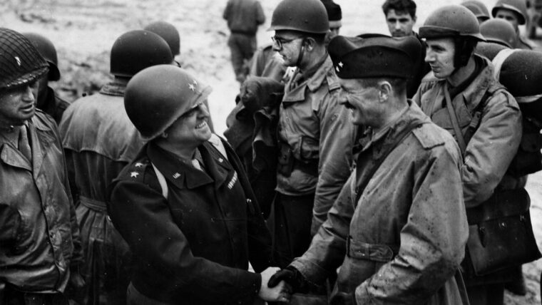 Major General Walton Walker, left, commander of U.S. XX Corps, greets Maj. Gen. Philippe Leclerc, commander of the 2nd French Armored Division, after the division landed at Utah Beach, Normandy, on August 1, 1944. The French division was then attached to Maj. Gen. Wade M. Haislip’s XV Corps, a part of George Patton’s Third U.S. Army. From Normandy, Leclerc would lead his men triumphantly to the liberation of Paris by the end of month. The 2nd French Armored Division notably took part in the Battle of the Falaise Pocket, the Battle of Dompaire, the Colmer Pocket and the push into Bavaria in May 1945.
