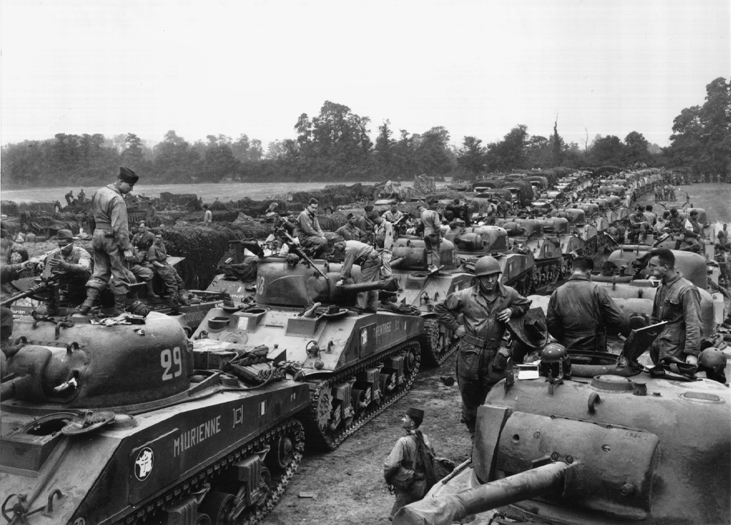Major General Jacques-Philippe Leclerc’s 2nd French Armored Division prepares to go into action against the Germans in the Falaise Pocket. Determined to liberate Paris, Leclerc was reluctant to get bogged down at Falaise.
