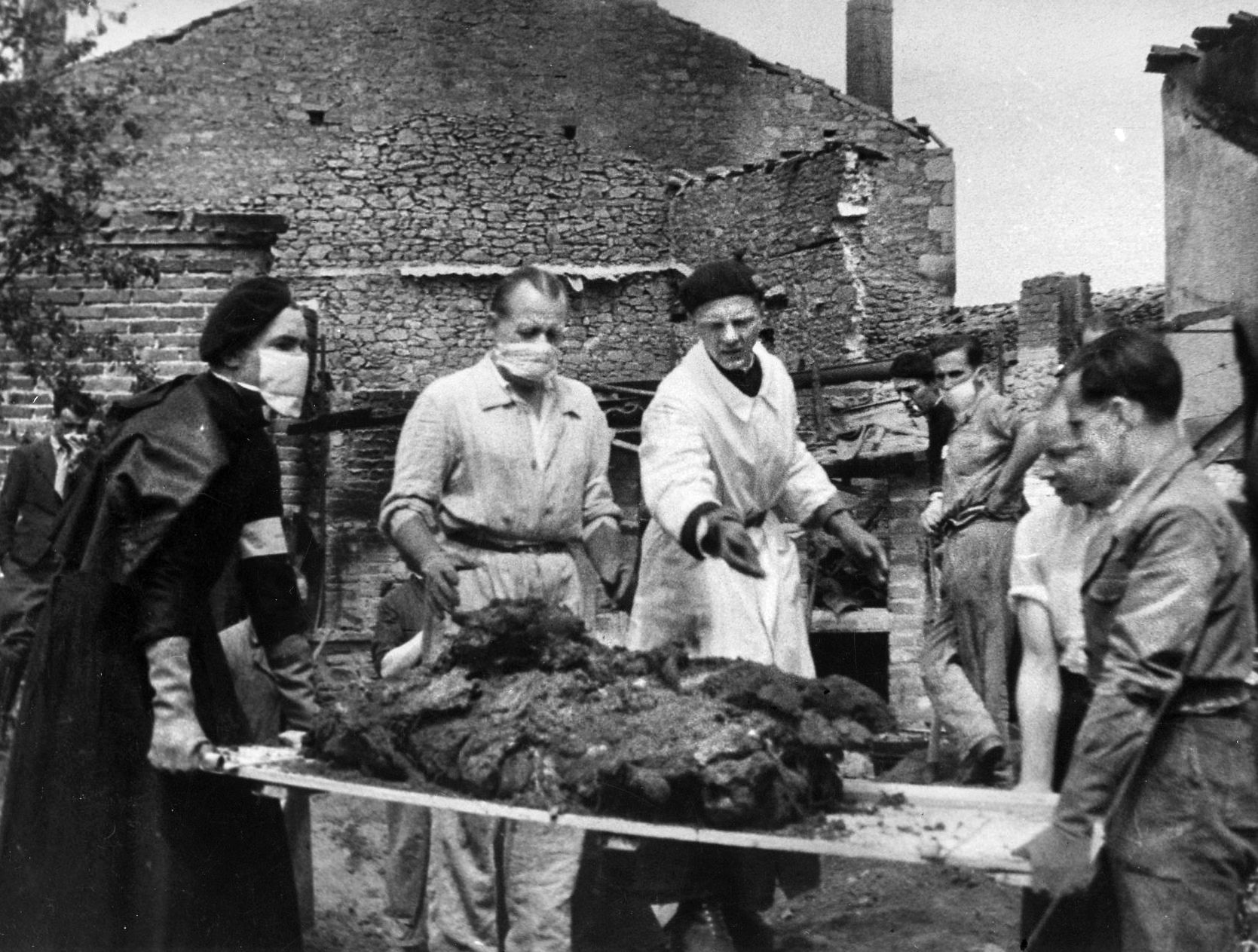 Aid workers, investigators and local villagers arrived on the scene as soon as the Germans left. They found two mass graves, a poor attempt to conceal the evidence, and were faced with the task of exhuming the charred remains, identifying them and giving 642 men, women and children, of whom only 52 could be identified, a decent burial. 