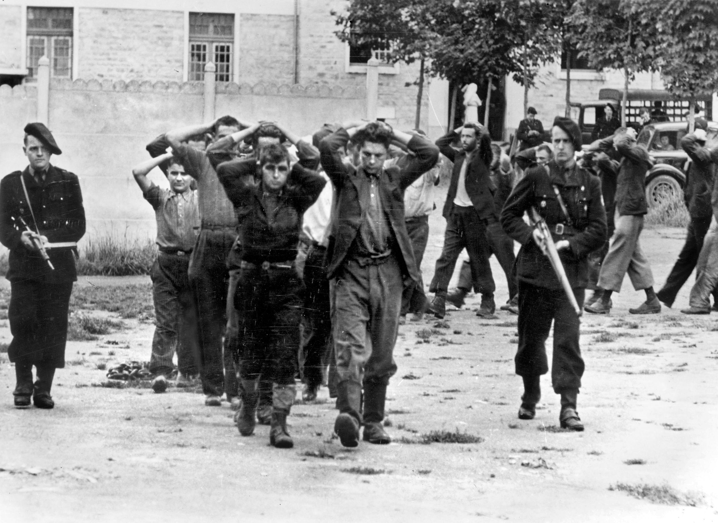 The Milice, a secret police force set up by the puppet Vichy government when France signed the armistice with Germany in 1940, arrest suspected Résistants. Four Milice were suspected to have helped Das Reich plan the Oradour massacre. After the Libération, many Milice were summarily executed as traitors by the French Résistance.